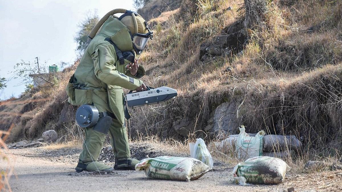 <div class="paragraphs"><p>Representative image of a bomb squad personnel checking for explosives.</p></div>