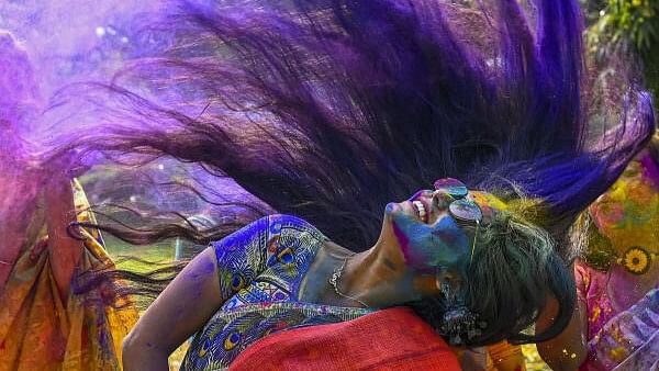 <div class="paragraphs"><p>A young woman drenched in colours celebrates Holi, in Nadia, Friday, March 22, 2024. Representative image.</p></div>