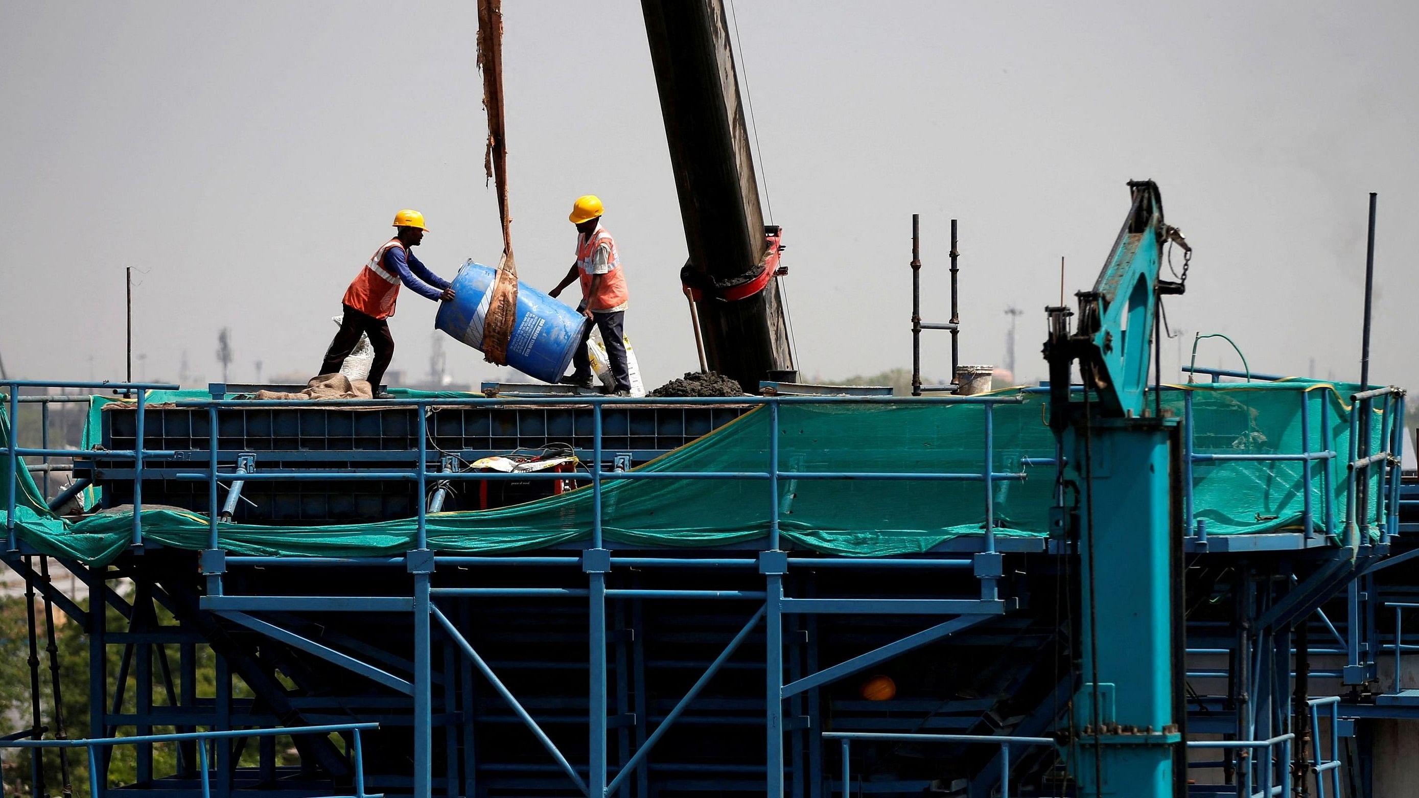 <div class="paragraphs"><p>Labourers work at a construction site. (Representative image)</p></div>