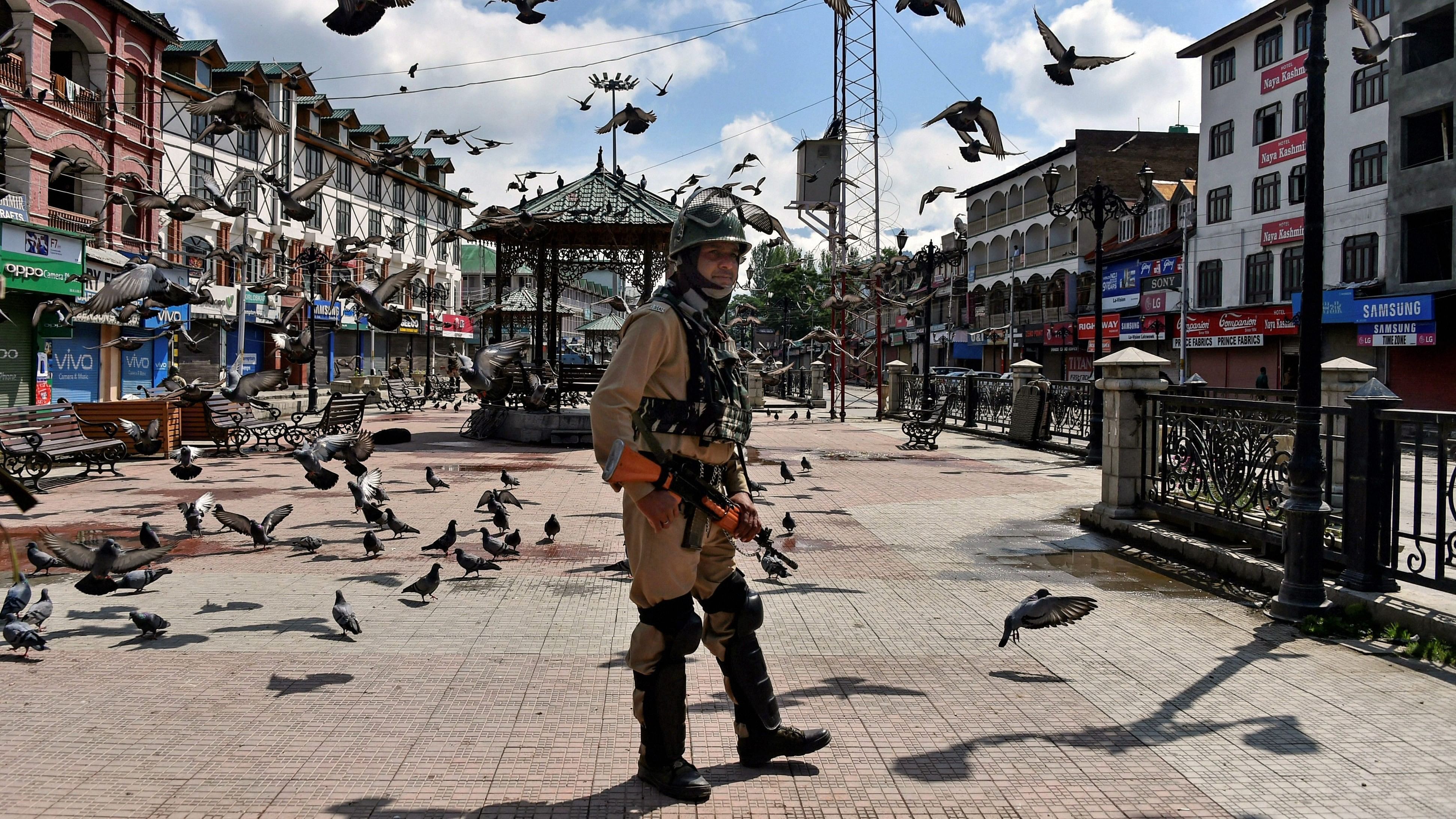 <div class="paragraphs"><p>A file photo of security person stands guard at Lal Chowk, in Srinagar.&nbsp;</p></div>