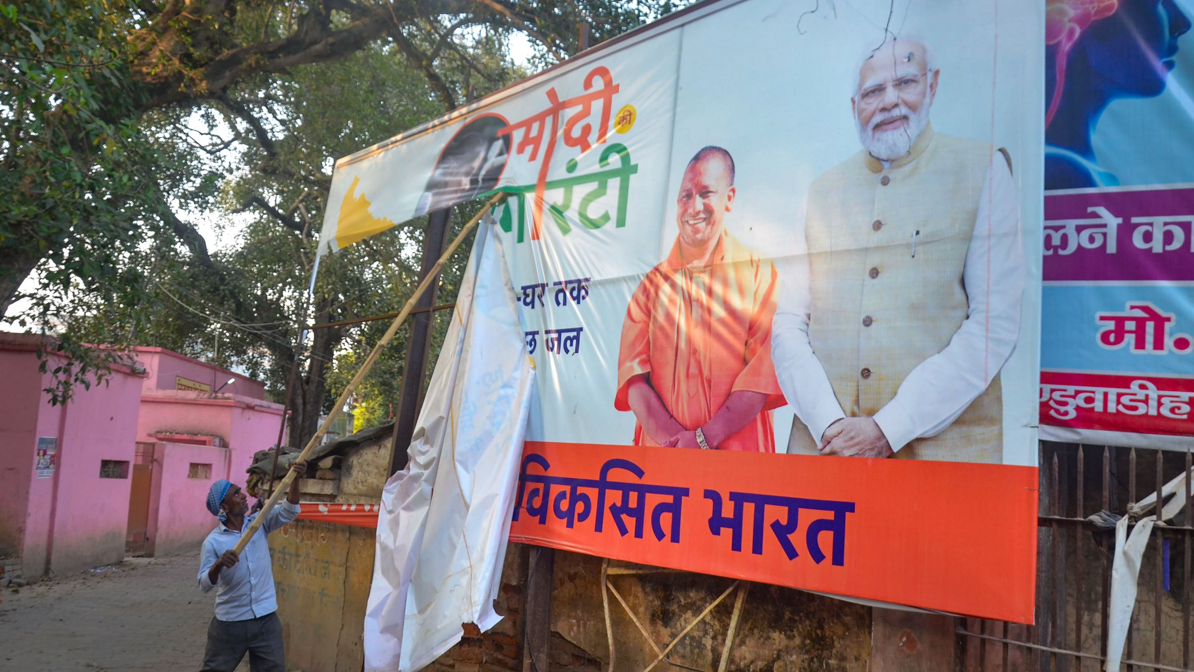 <div class="paragraphs"><p> A worker removes posters of political leaders after the Model Code of Conduct was enforced.</p></div>