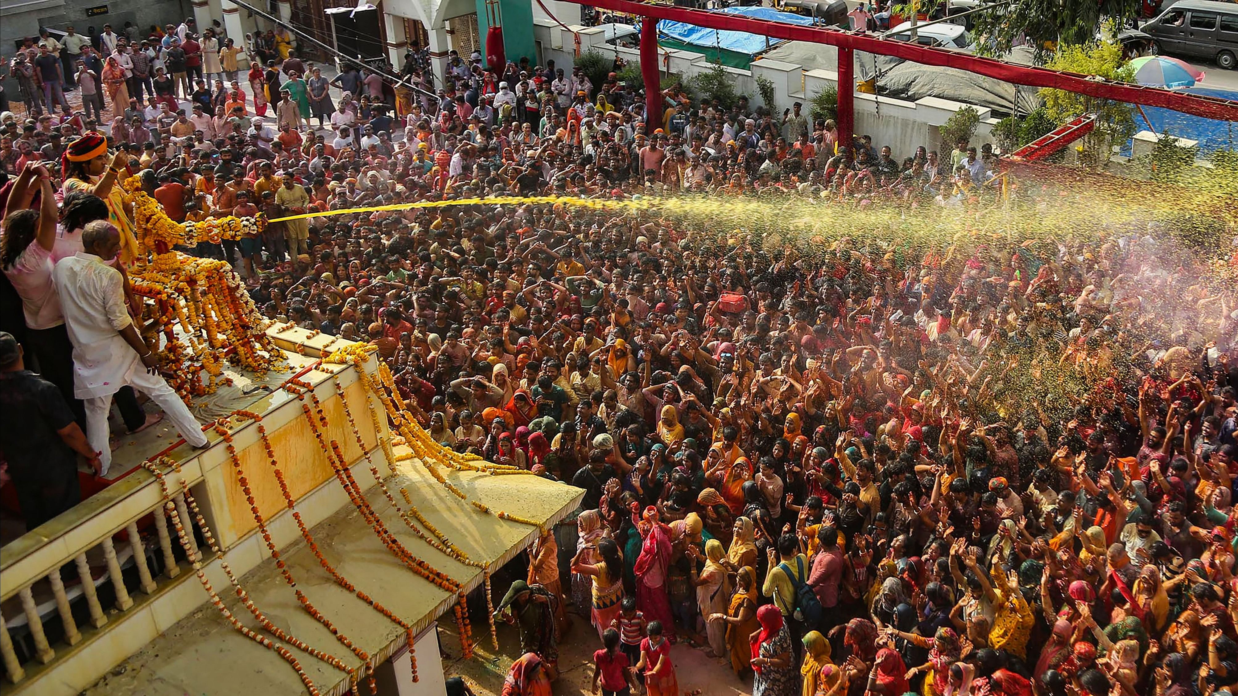 <div class="paragraphs"><p>Devotees play Holi at Shri Priyakantju temple in Vrindavan near Mathura.</p></div>