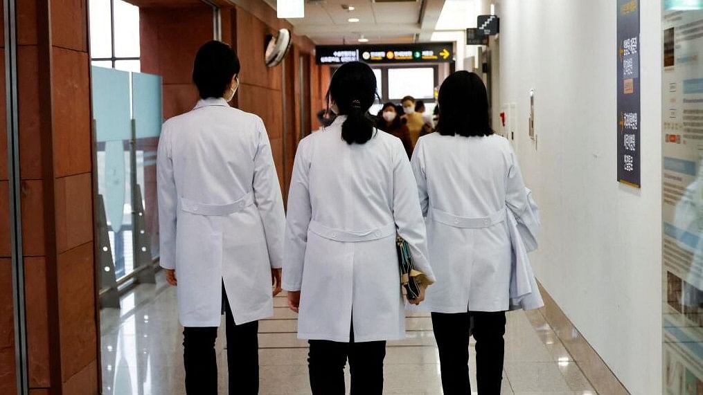 <div class="paragraphs"><p>Medical workers walk at Severance Hospital in Seoul, South Korea.</p></div>