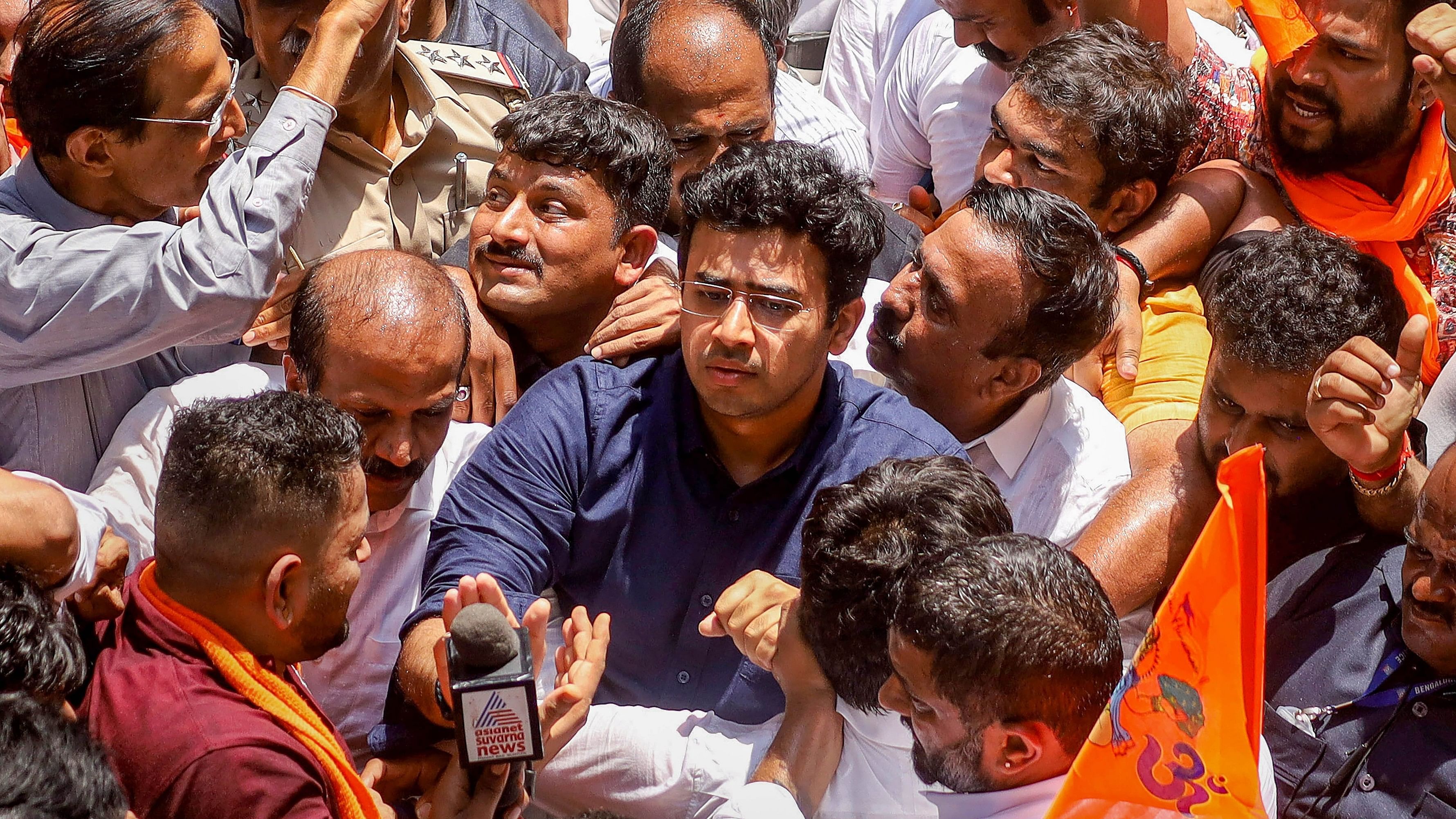 <div class="paragraphs"><p>BJP MP Tejasvi Surya takes part in a protest after a shopkeeper was assaulted by a group of men for allegedly playing 'Hanuman Chalisa' over a loudspeaker in his shop during 'Azaan', at Nagarathpet, in Bengaluru, Tuesday, March 19, 2024. </p></div>