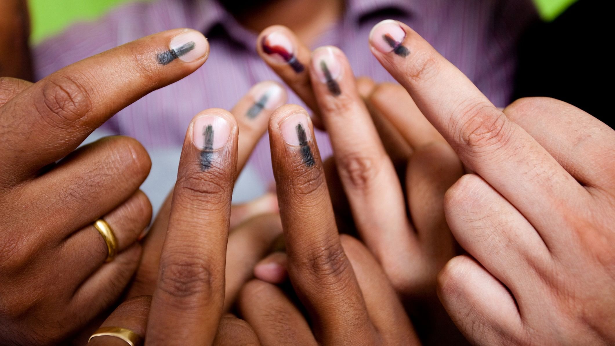 <div class="paragraphs"><p>Representative image showing voters with indelible ink on their fingers.</p></div>