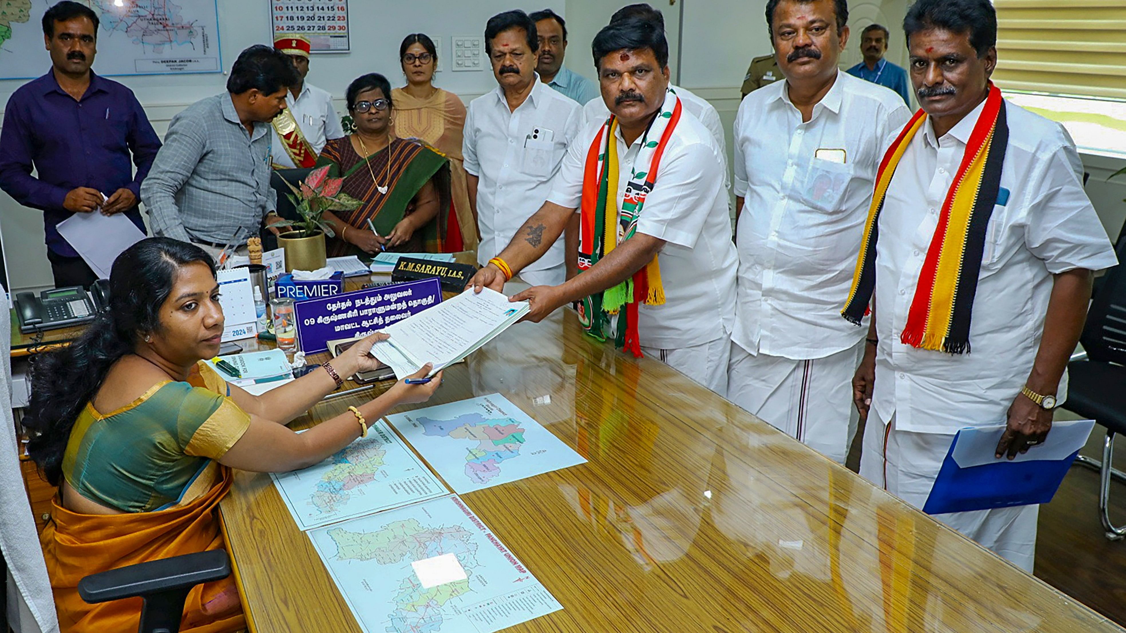 <div class="paragraphs"><p>AIADMK candidate for Krishnagiri Lok Sabha constituency Jayaprakash files his nomination papers before District Electoral Officer KM Sarayu, in Krishnagiri.</p></div>