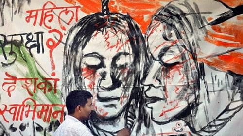 <div class="paragraphs"><p>An artist draws a painting raising issues of women safety, in Moradabad. </p></div>