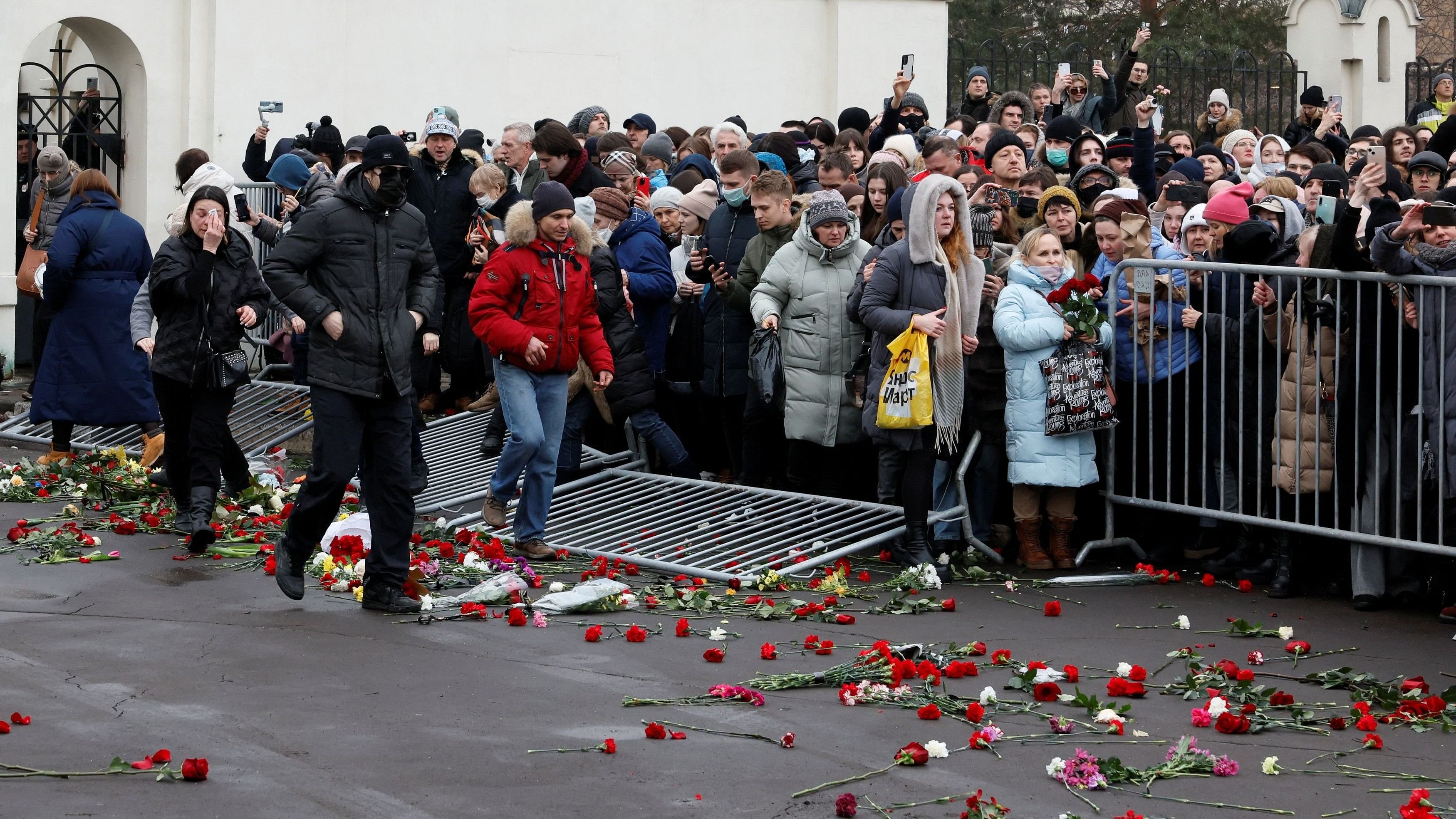 <div class="paragraphs"><p>People knock down barriers gather while leaving an area outside the Soothe My Sorrows church, where a funeral service and a farewell ceremony for Russian opposition politician Alexei Navalny were held, in Moscow, Russia, March 1, 2024. </p></div>