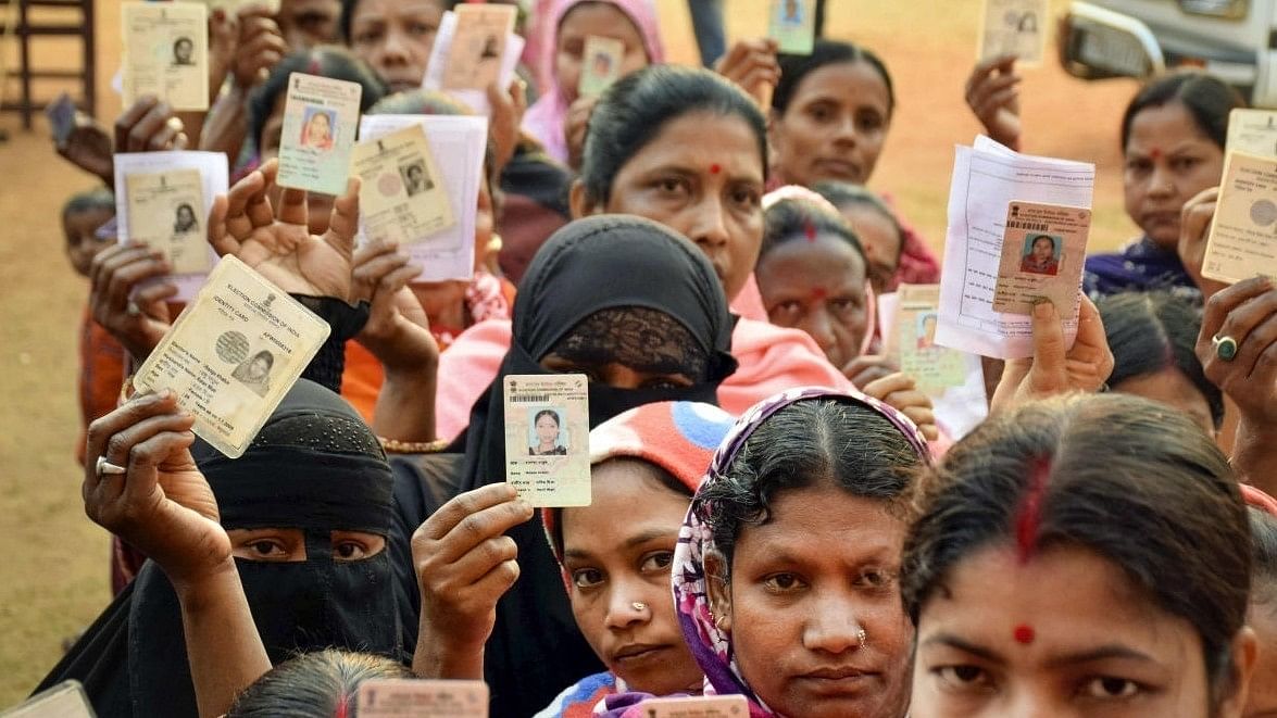 <div class="paragraphs"><p>Representative image showing voters displaying their voter ID cards during an election.</p></div>