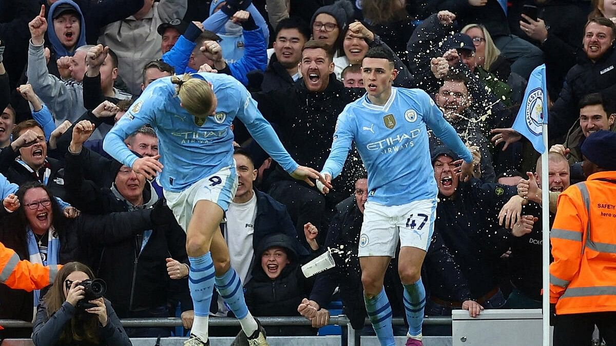 <div class="paragraphs"><p>Manchester City's Phil Foden celebrates scoring their first goal with Erling Braut Haaland.&nbsp;</p></div>