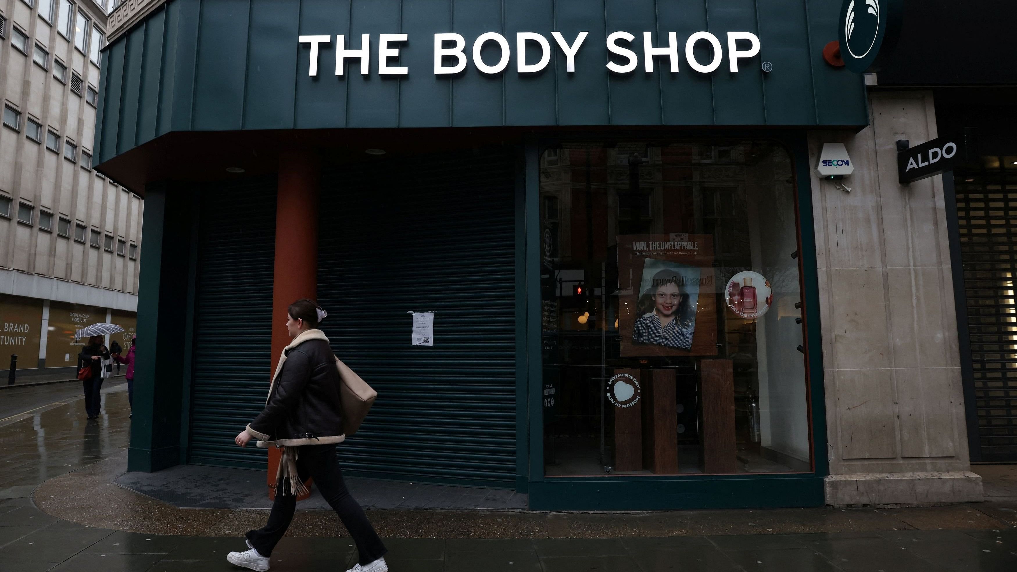 <div class="paragraphs"><p>A pedestrian walks past a closed The Body Shop store.</p></div>