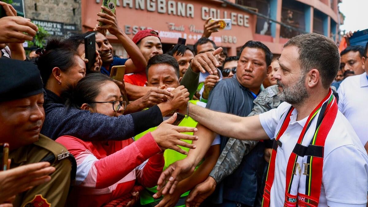 <div class="paragraphs"><p>Congress leader Rahul Gandhi greets supporters during a 'Padyatra' in Mizoram.</p></div>