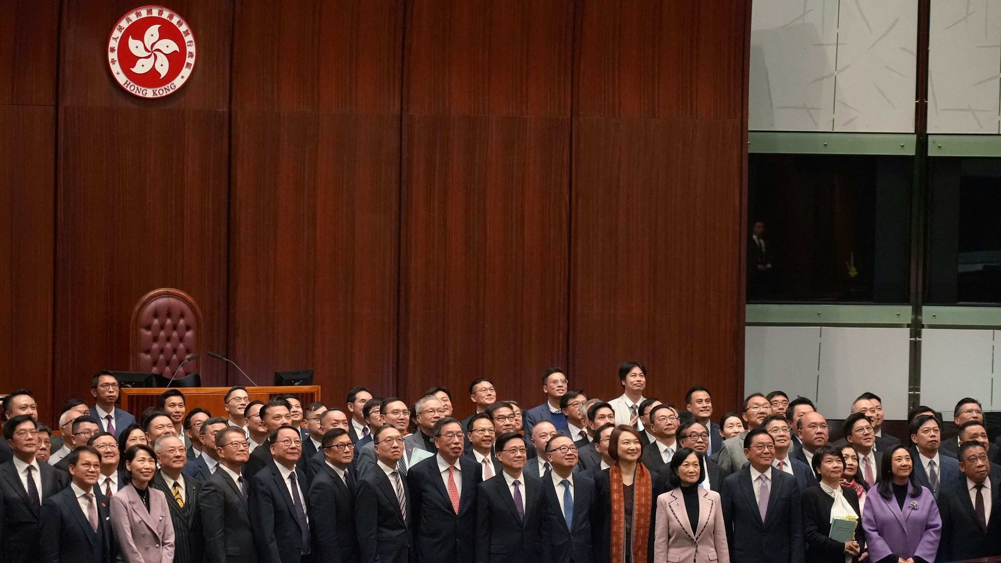 <div class="paragraphs"><p>Hong Kong Chief Executive John Lee, government officials and lawmakers pose for a group photo, after the Safeguarding National Security Bill, also referred to as Basic Law Article 23, was passed at the Hong Kong’s Legislative Council, in Hong Kong, China March 19, 2024. </p></div>