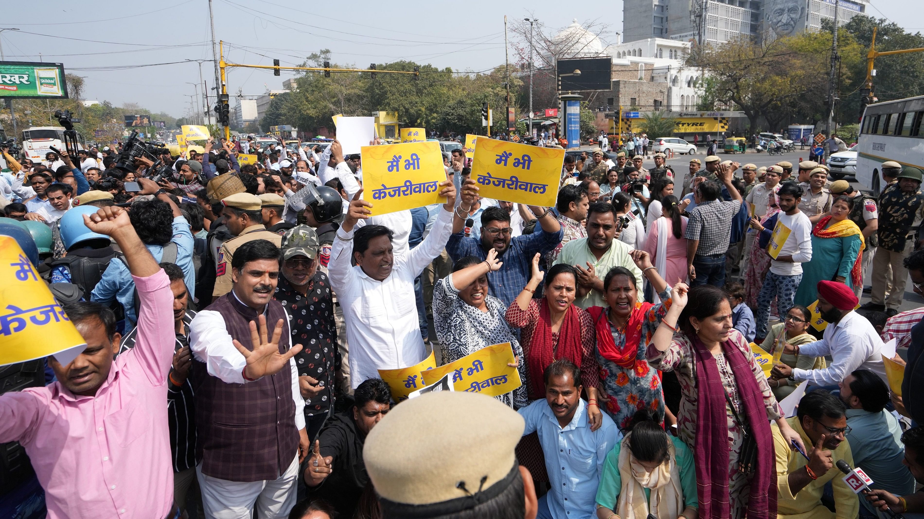 <div class="paragraphs"><p>Delhi Minister Atishi with AAP workers raise slogans during a protest at ITO against the arrest of Chief Minister Arvind Kejriwal.</p></div>