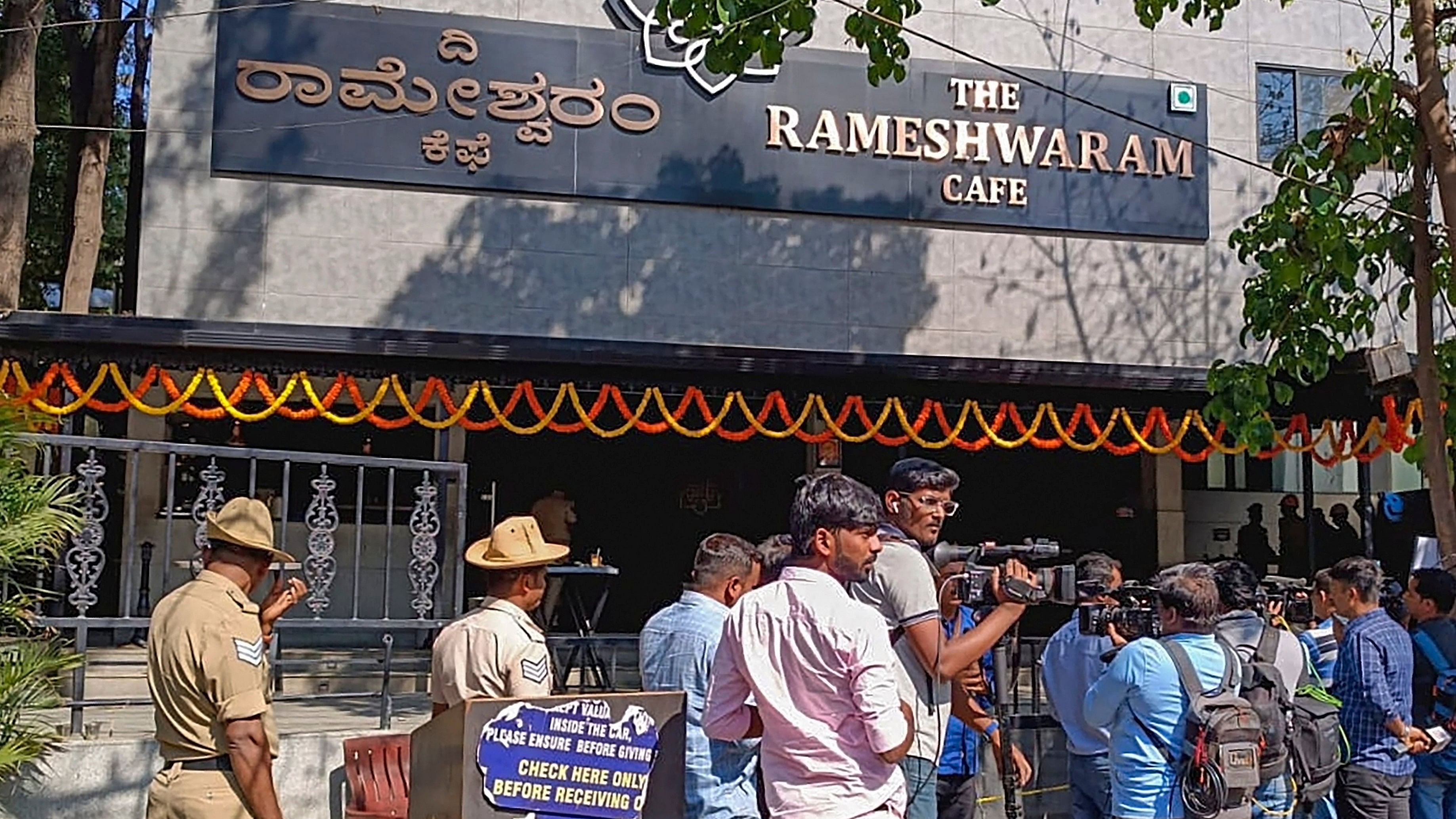 <div class="paragraphs"><p>Police and media outside The&nbsp;Rameshwaram Cafe in Bengaluru.</p></div>