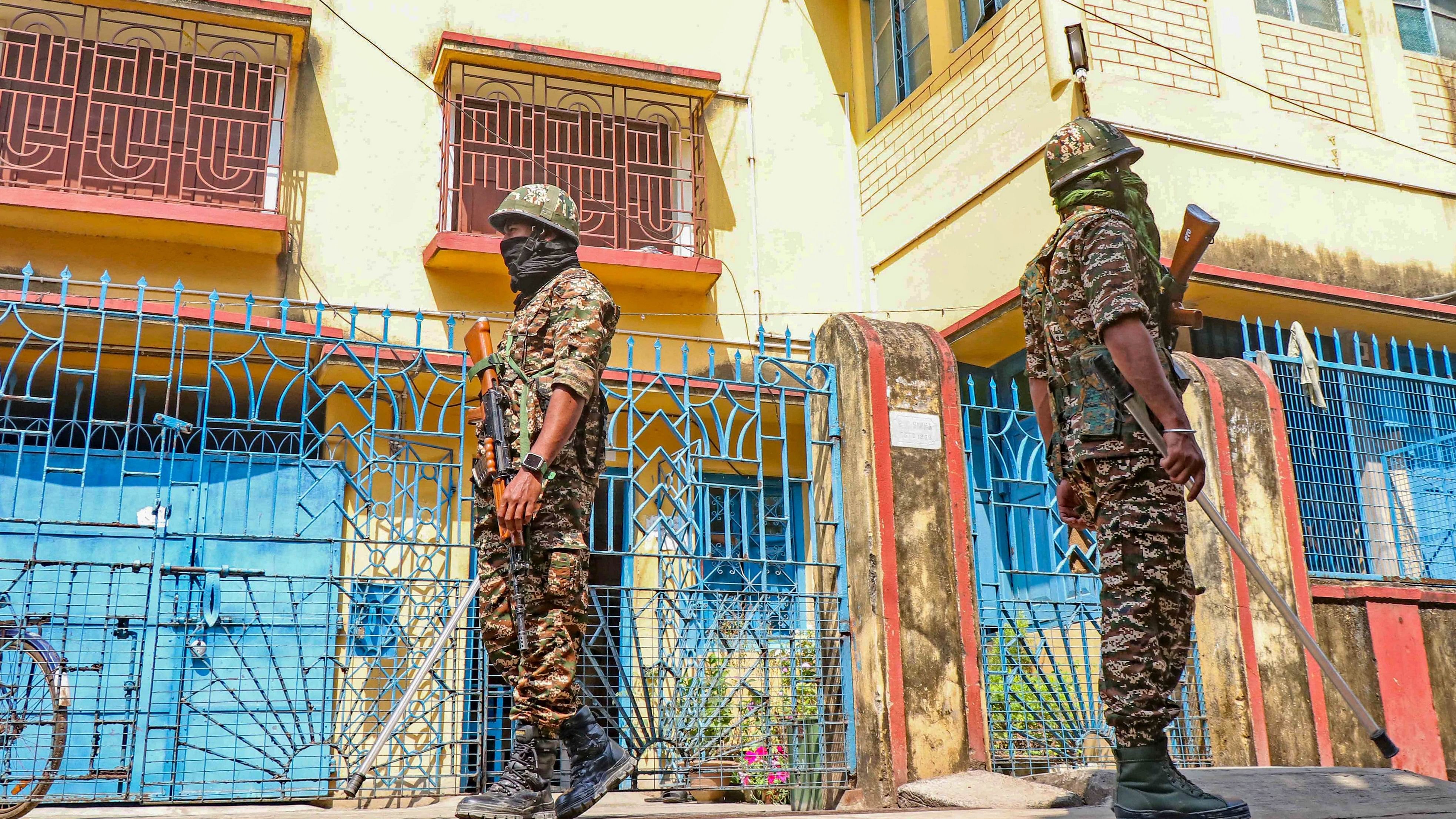 <div class="paragraphs"><p>Birbhum: Security personnel stand guard outside West Bengal Minister of MSME and Textiles Chandranath Sinha's residence during a raid by Enforcement Directorate (ED) in connection with alleged teachers' recruitment scam, at Bolpur in Birbhum district, Friday, March 22, 2024.</p></div>