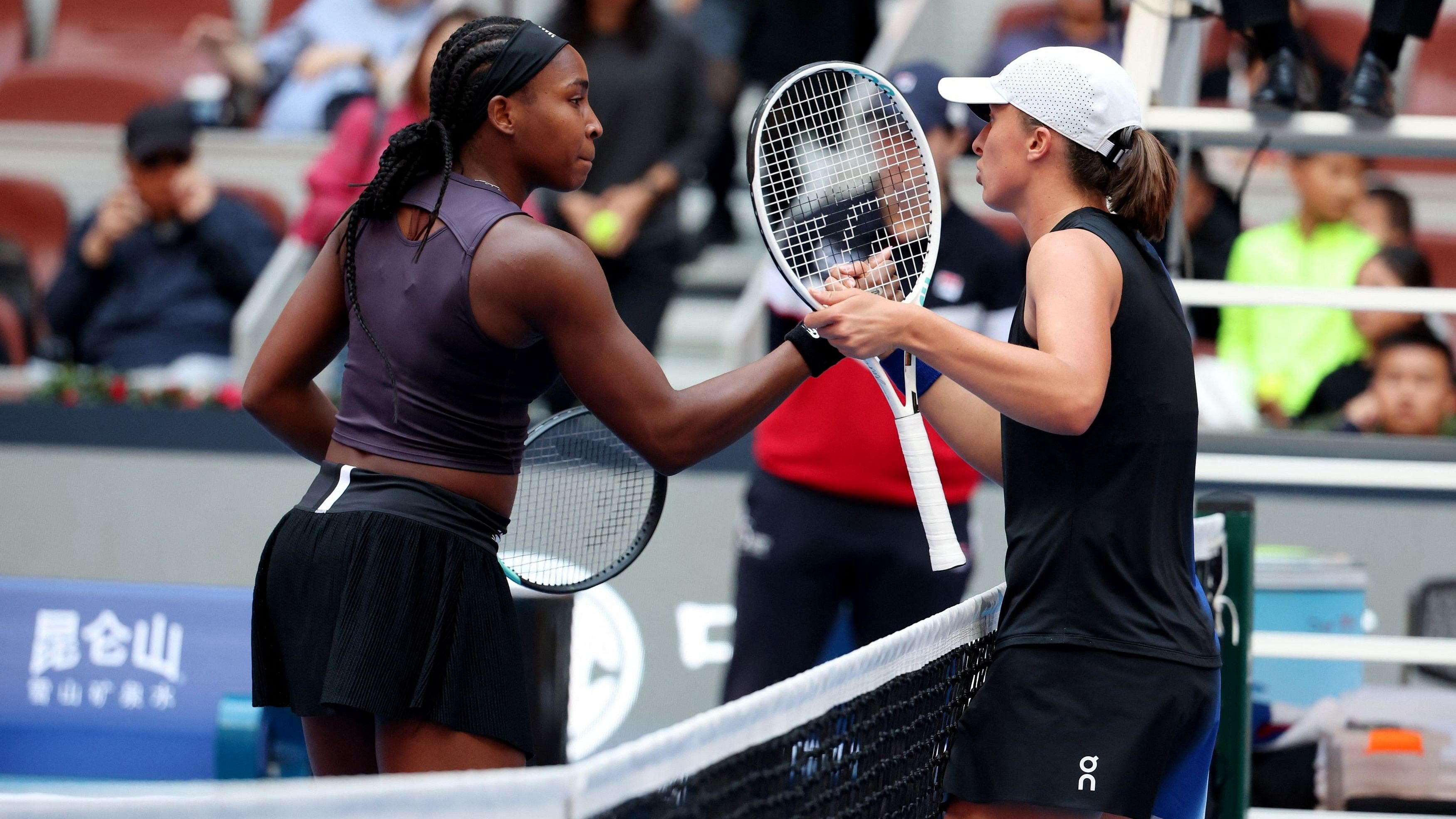 <div class="paragraphs"><p>Coco Gauff of the United States shakes hands with Poland's Iga Swiatek.</p></div>