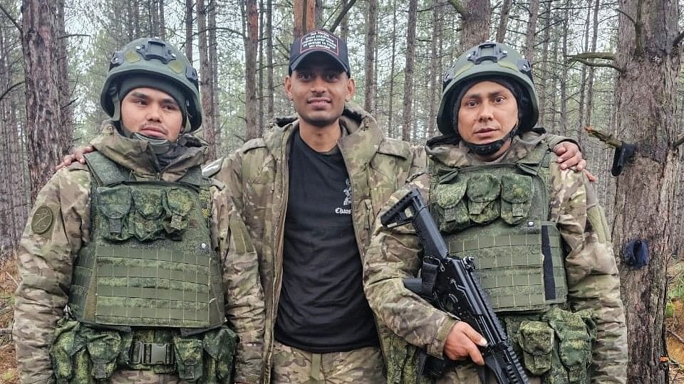 <div class="paragraphs"><p>Hemil Mangukiya, middle, poses for a photograph with two other men in military uniform, in this undated handout picture.&nbsp;A missile strike killed Hemil in Ukraine on February 21.</p></div>
