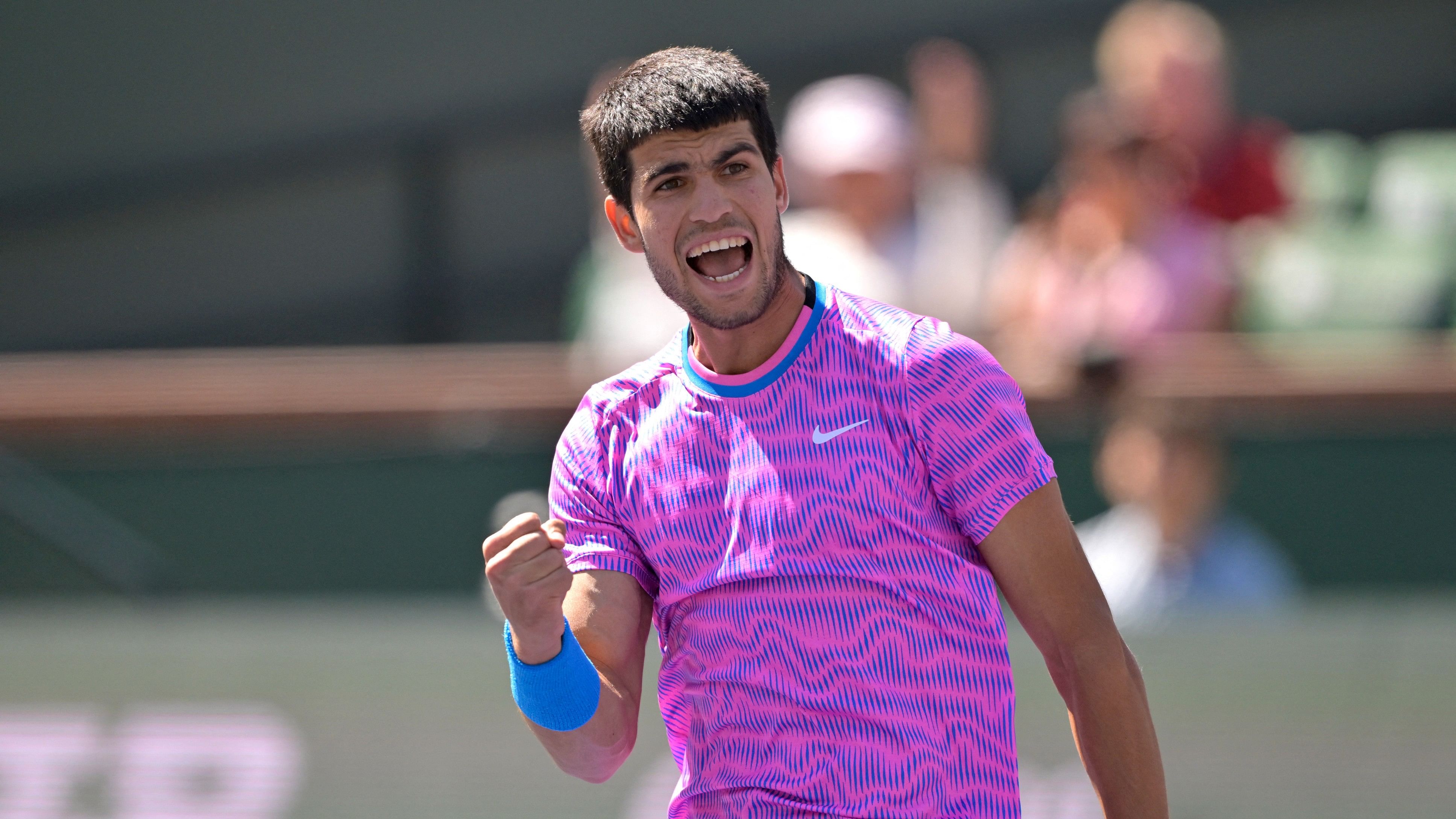 <div class="paragraphs"><p>Carlos Alcaraz (ESP) reacts after winning a point in his fourth round match defeating Fabian Marozsan (HUN) in the BNP Paribas Open at the Indian Wells Tennis Garden. </p></div>