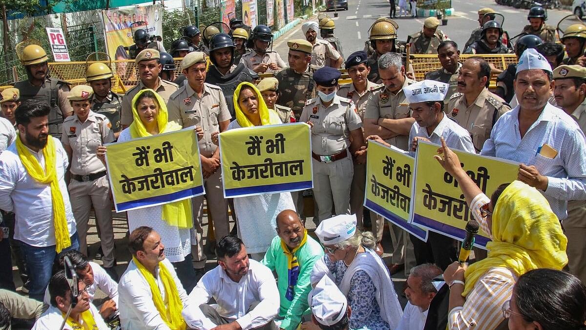 <div class="paragraphs"><p>Aam Aadmi Party (AAP) workers stage a protest against the arrest of Delhi Chief Minister Arvind Kejriwal, in front of the BJP office, in Gurugram.</p></div>