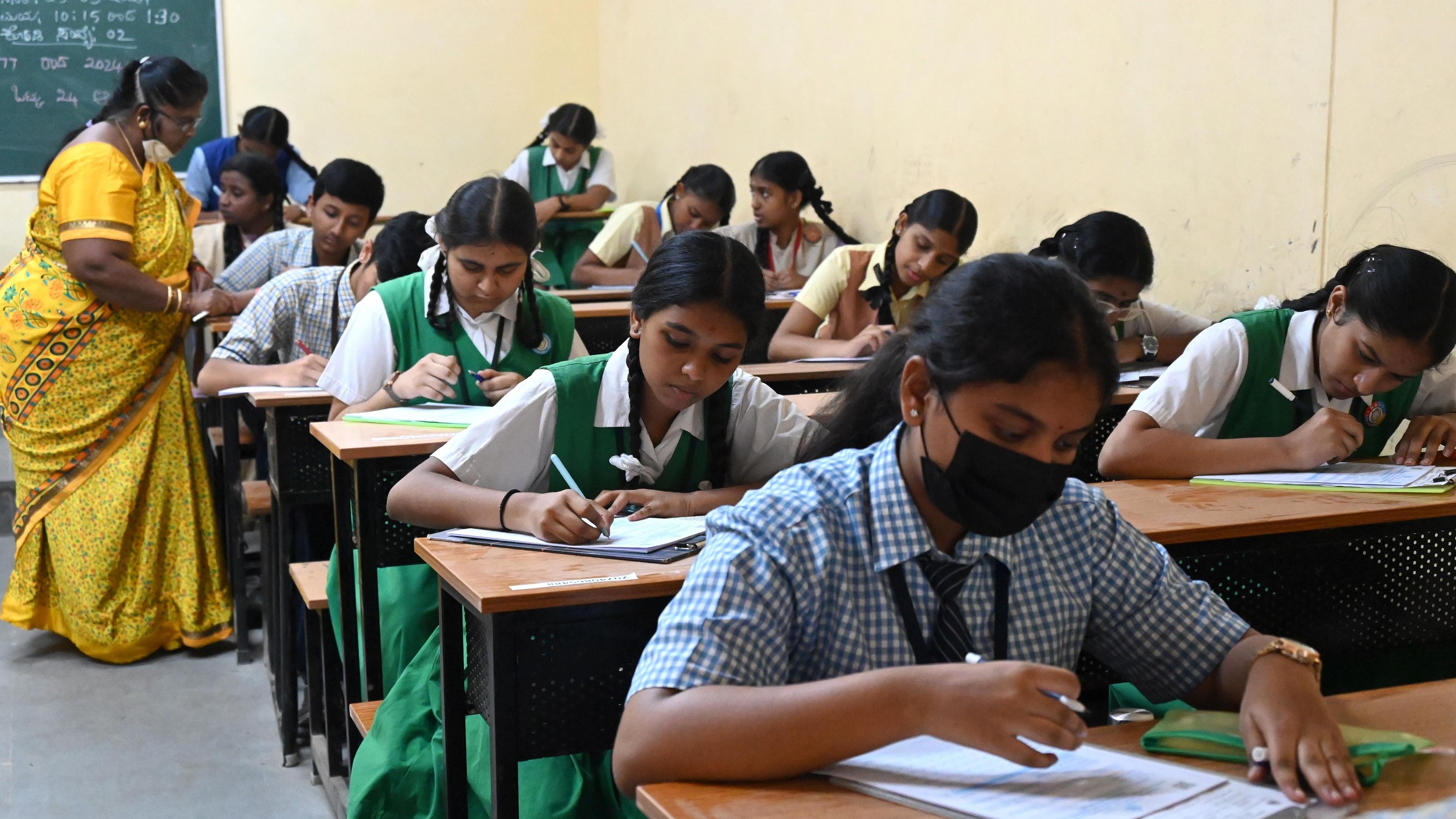 <div class="paragraphs"><p>Students attending first day of SSLC exam at the Government school at Malleshwara in Bengaluru on Monday. </p></div>