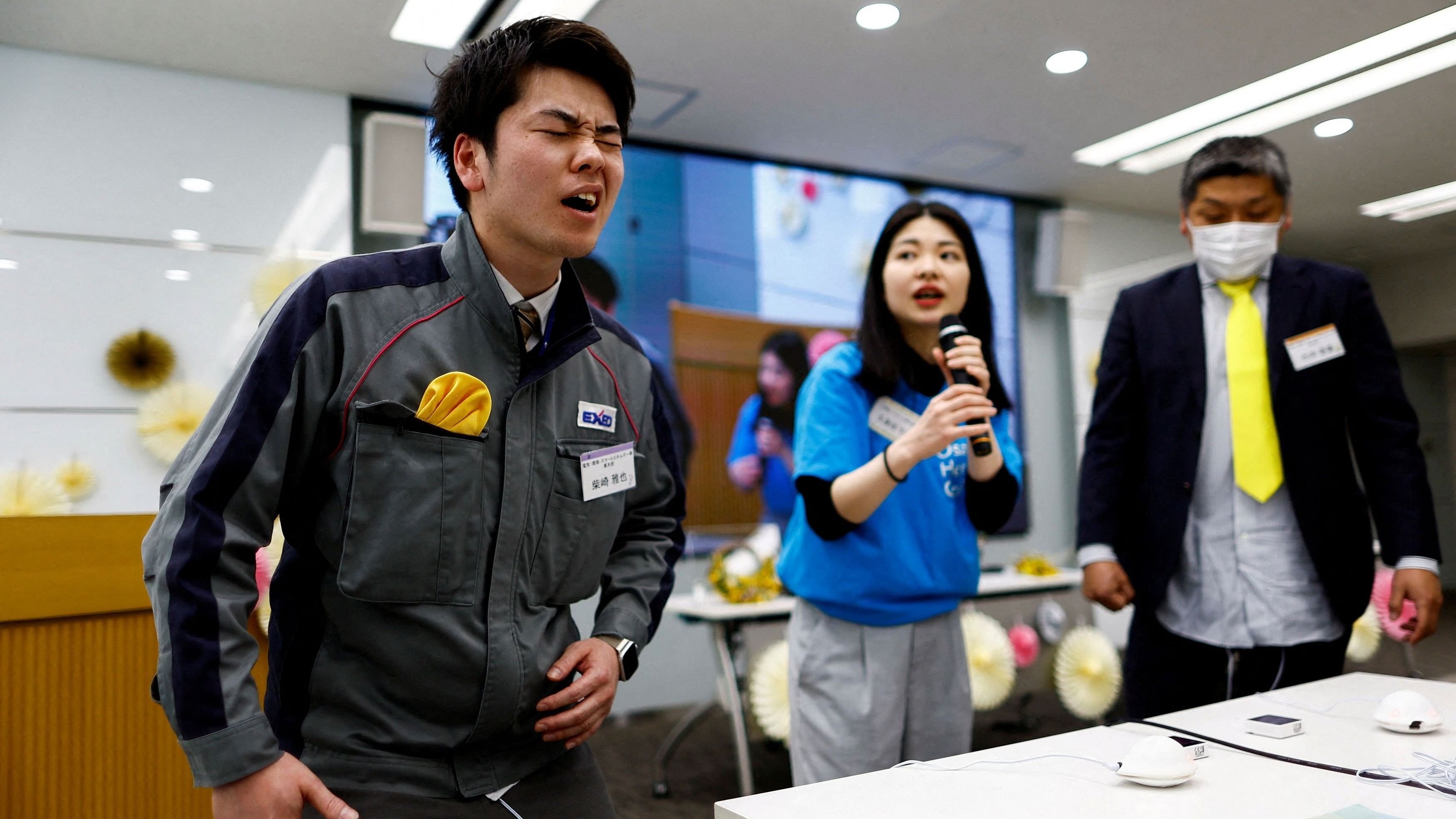 <div class="paragraphs"><p>Masaya Shibasaki, 26, an employee of EXEO Group Inc, reacts as he tries the Osaka Heart Cool developed VR electrical device 'Perionoid' which releases electrical stimulation that feels like experiencing women's menstrual pain, in Tokyo, Japan.</p></div>