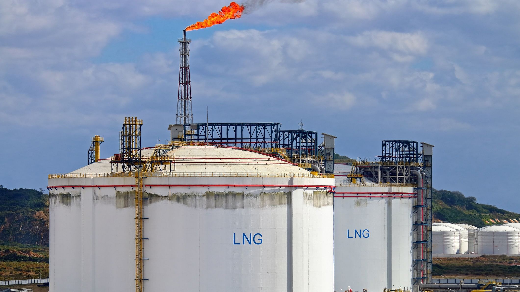 <div class="paragraphs"><p>Representative image of&nbsp;large LNG (Liquefied natural gas) tanks at LNG regasification terminal, with gas flare stack</p></div>