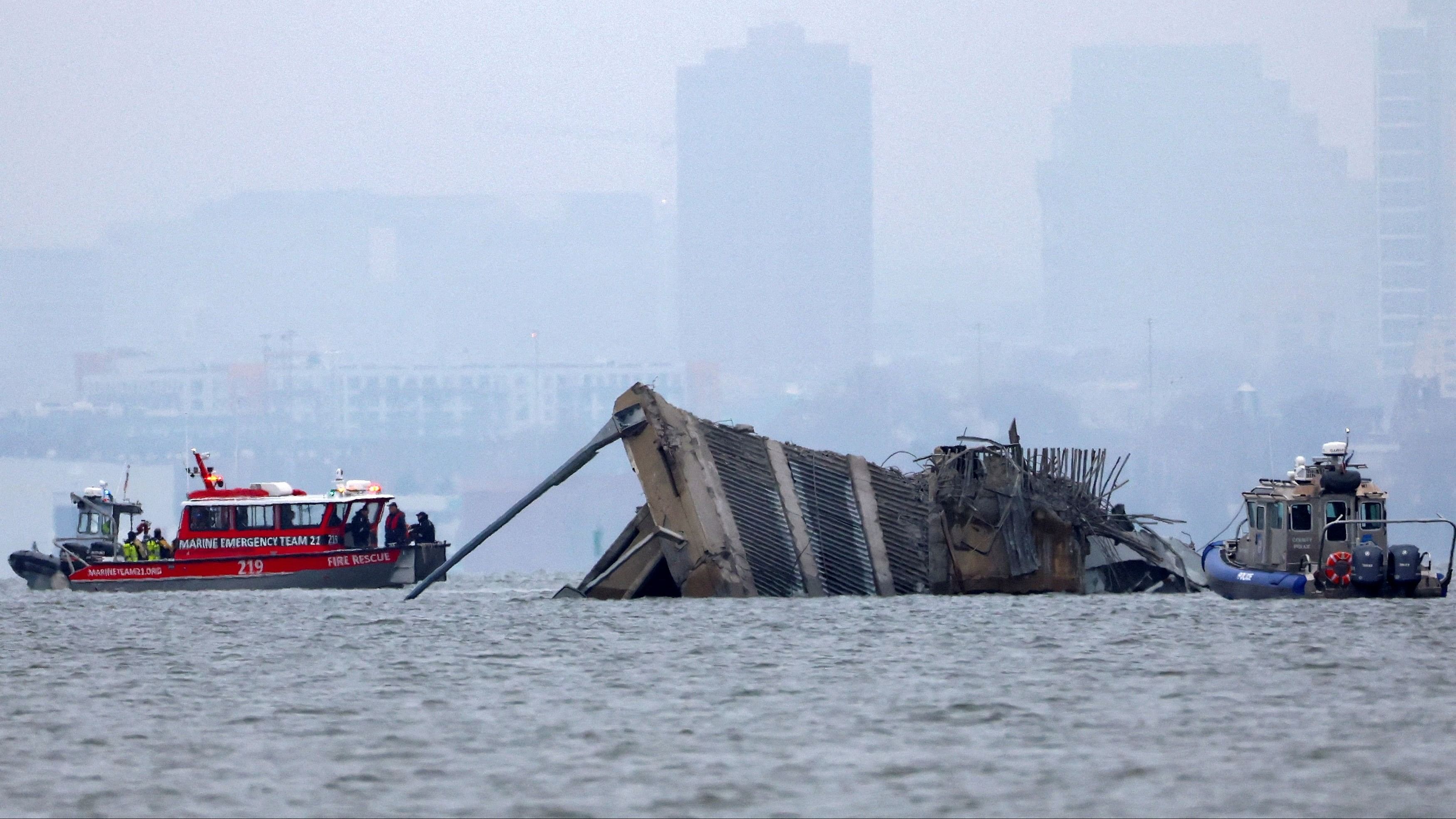 <div class="paragraphs"><p>An emergency marine boat with divers and a police boat work near the collapsed section of the Francis Scott Key Bridge, after the Dali cargo vessel crashed into it, in Baltimore, Maryland, U.S., March 27, 2024. </p></div>