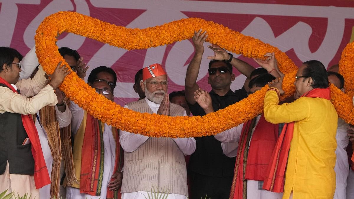 <div class="paragraphs"><p>Prime Minister Narendra Modi being garlanded during a public meeting, at Krishnanagar in Nadia district, Saturday, March 2, 2024.</p></div>