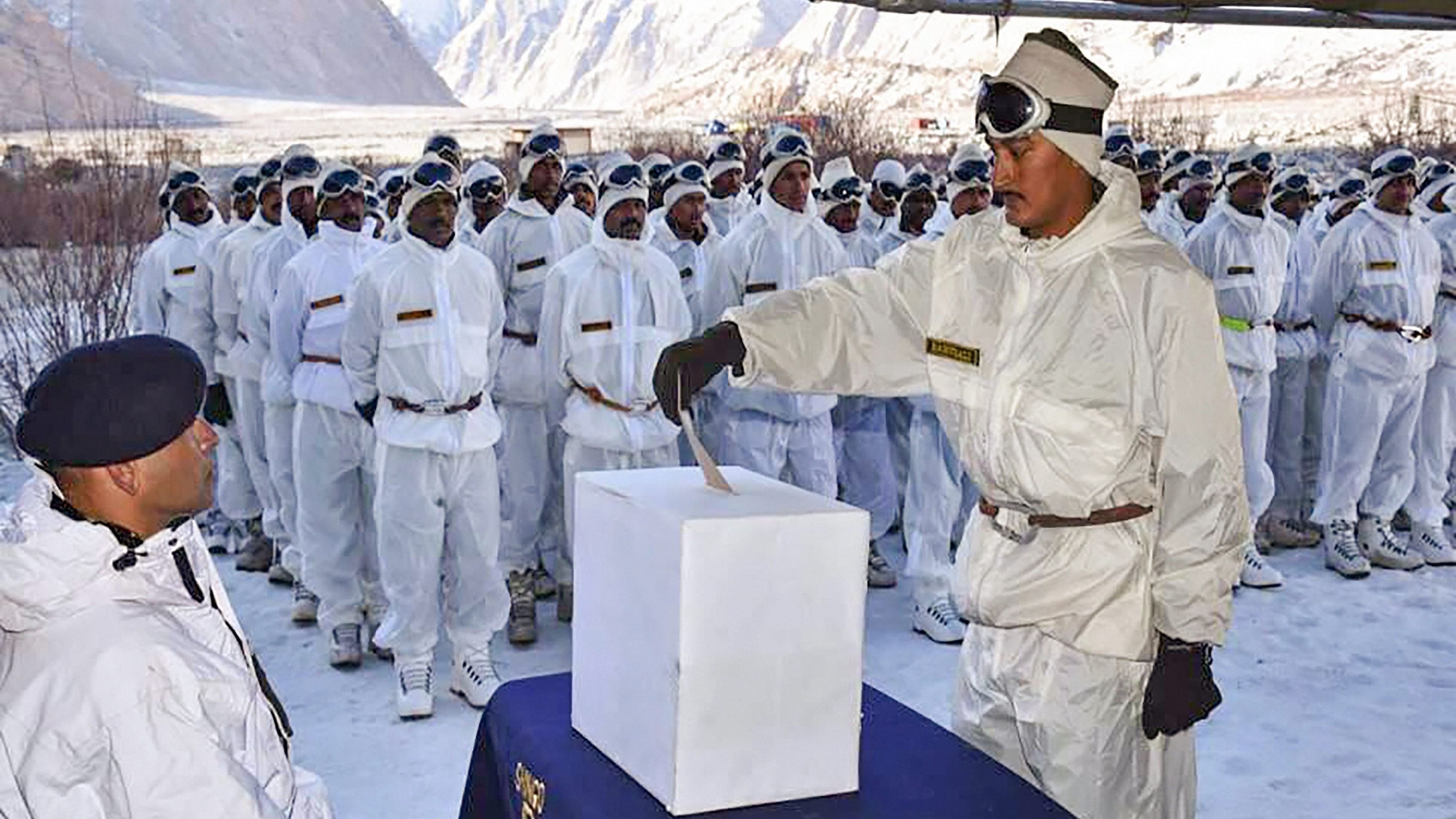 <div class="paragraphs"><p>An army soldier casts his vote for the Lok Sabha elections as a Service voter, at Field Post Office in Siachen.</p></div>