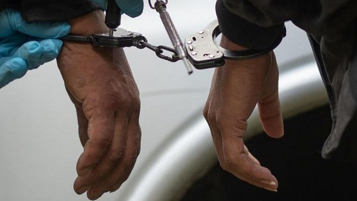 <div class="paragraphs"><p>Representative image showing two people handcuffed.</p></div>