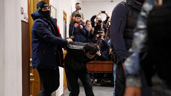 <div class="paragraphs"><p>A suspect in the shooting attack at the Crocus City Hall concert venue, is escorted before a court hearing at the Basmanny district court in Moscow, Russia on March 25, 2024.</p></div>