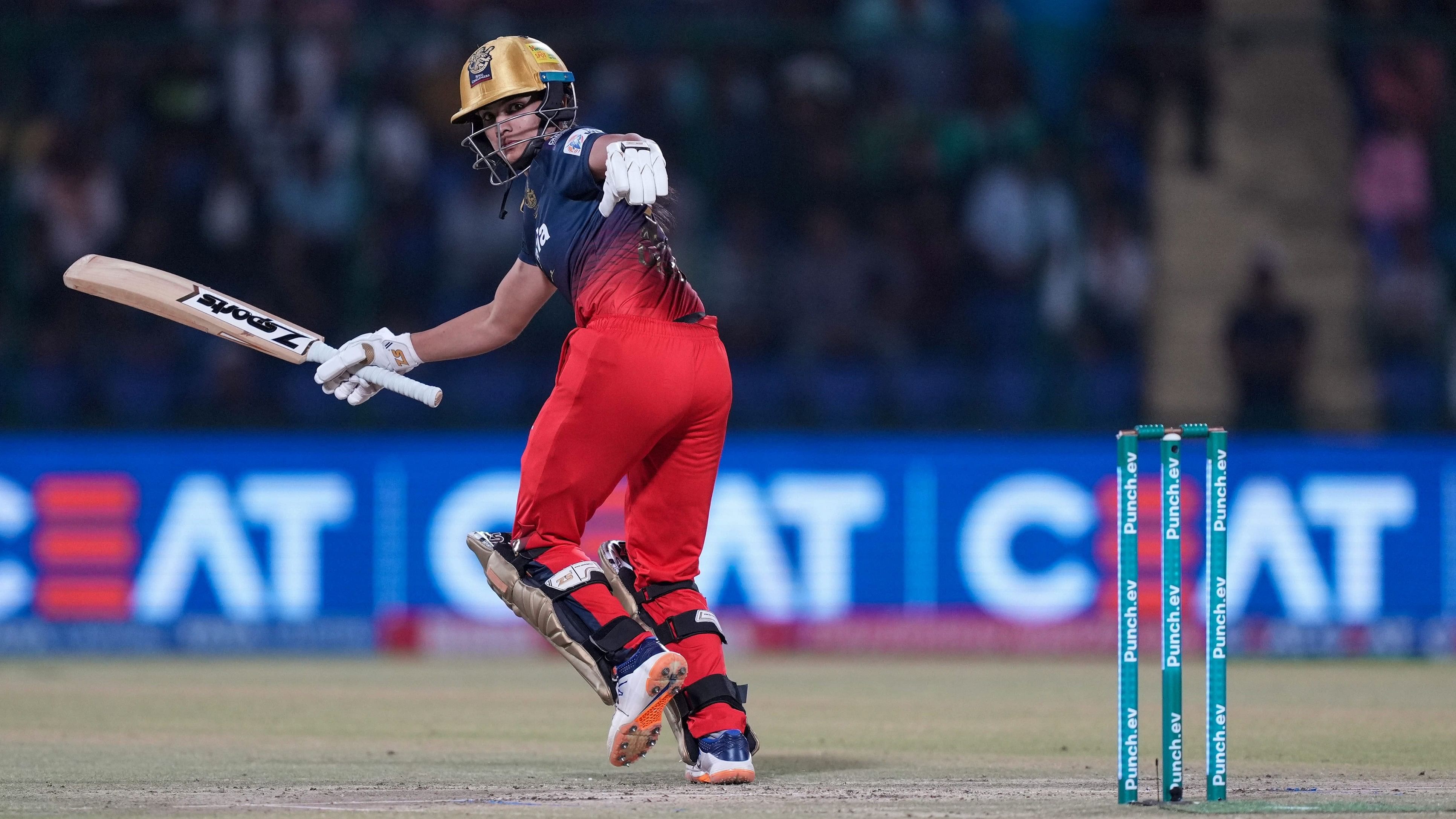 <div class="paragraphs"><p>Royal Challengers Bangalore batter Disha Kasat plays a shot during the Women's Premier League (WPL) 2024 cricket match between Mumbai Indians and Royal Challengers Bangalore.</p></div>