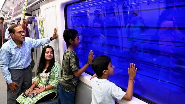 <div class="paragraphs"><p>Commuters travel in the country's first underwater metro train after its commercial services began, in Kolkata, Friday, March 15, 2024.</p></div>