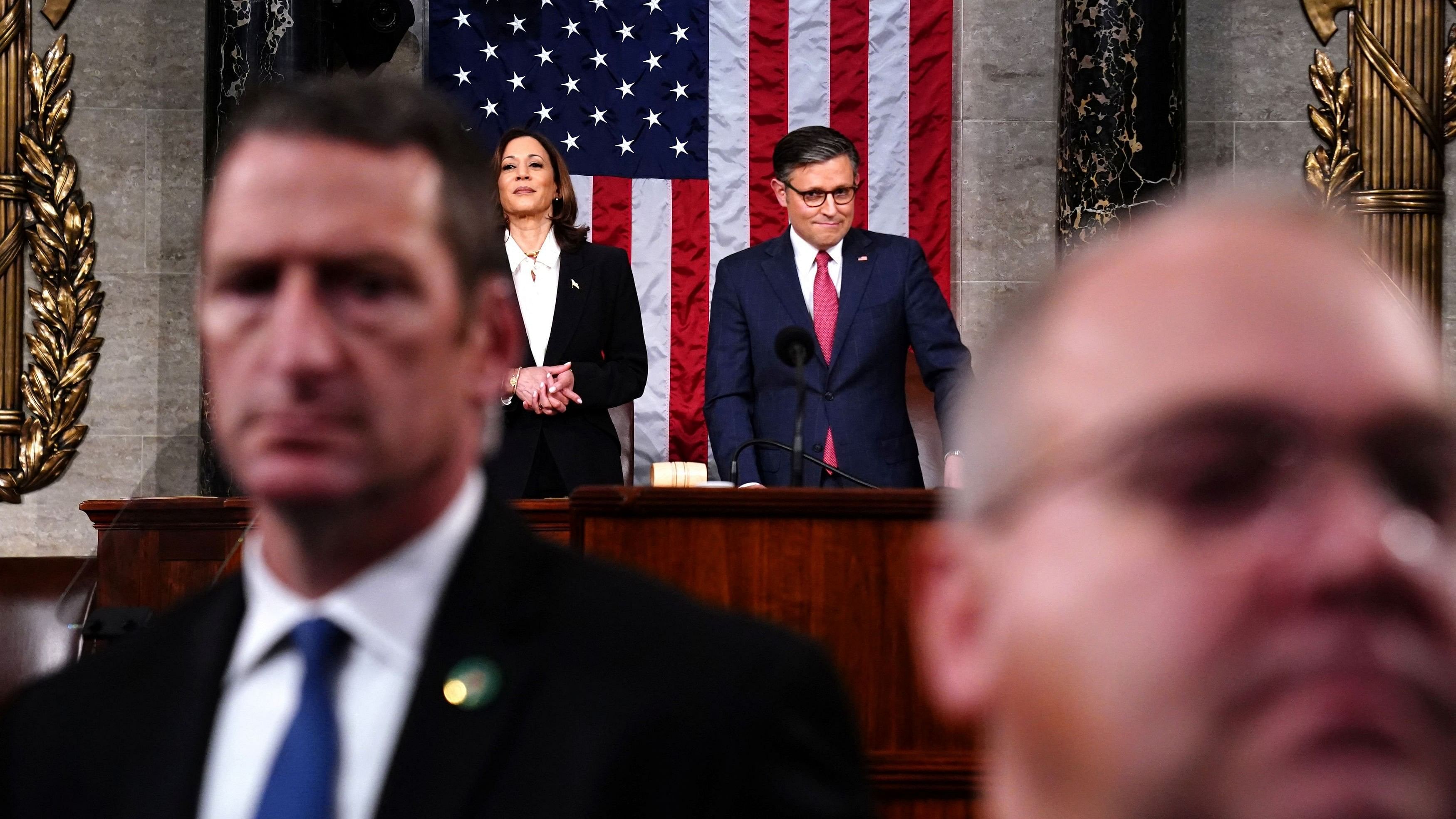 <div class="paragraphs"><p>Speaker of the House Mike Johnson  look on as US President Joe Biden departs following his third State of the Union address to a joint session of Congress in the US Capitol in Washington, DC, USA, 07 March 2024.     </p></div>