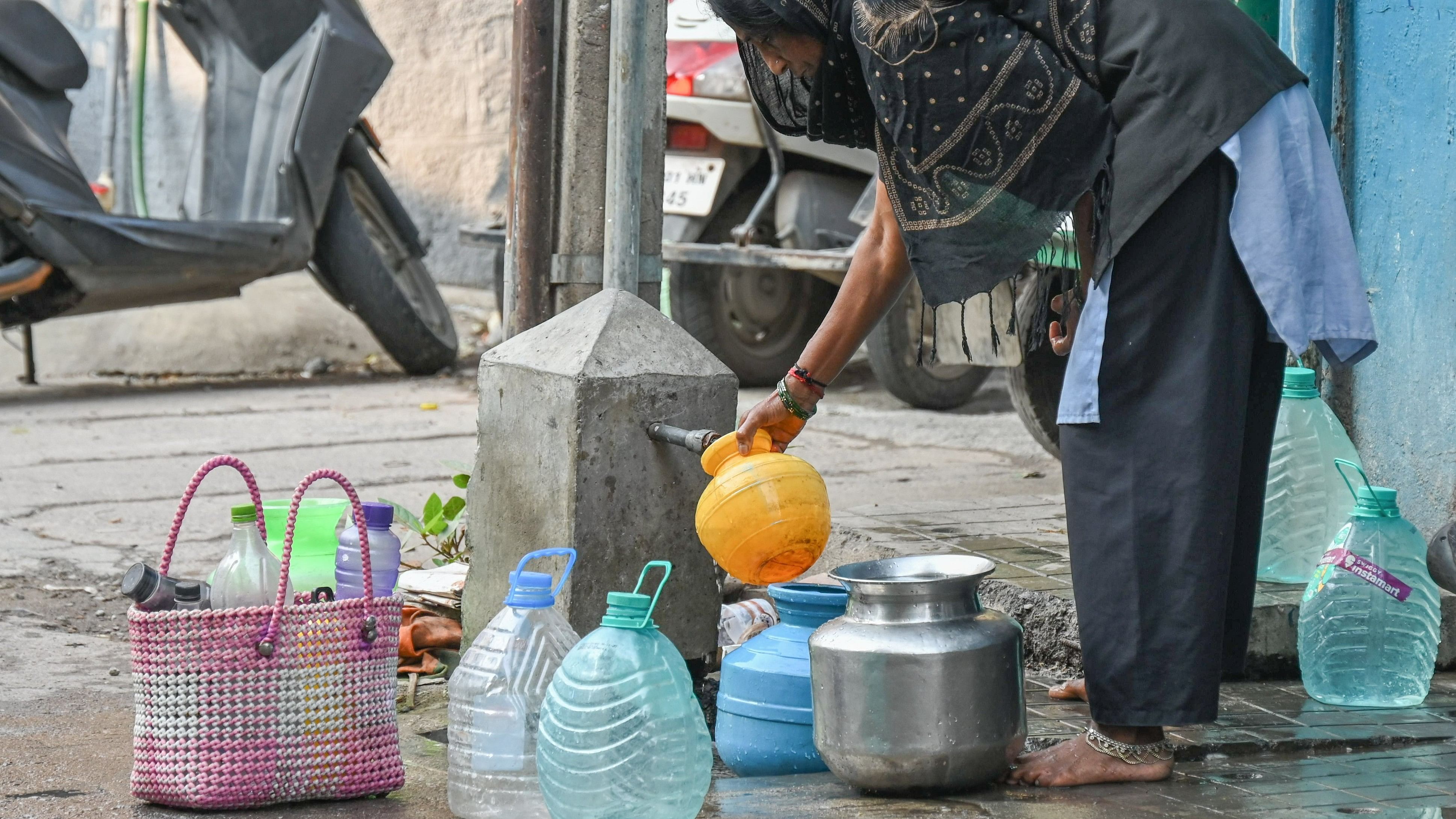 <div class="paragraphs"><p>A woman collects drinking water from a public tap in Chinnaiyan Palya. </p></div>