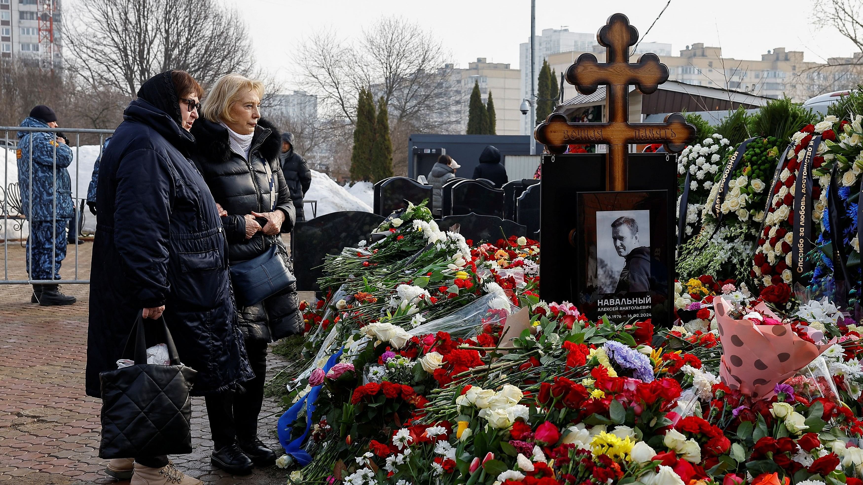 <div class="paragraphs"><p>Russian opposition leader Alexei Navalny and his widow Yulia Navalnaya's mothers, Lyudmila and Alla, stand in front the grave of Alexei Navalny the day after the funeral at the Borisovskoye cemetery in Moscow, Russia, March 2, 2024. </p></div>