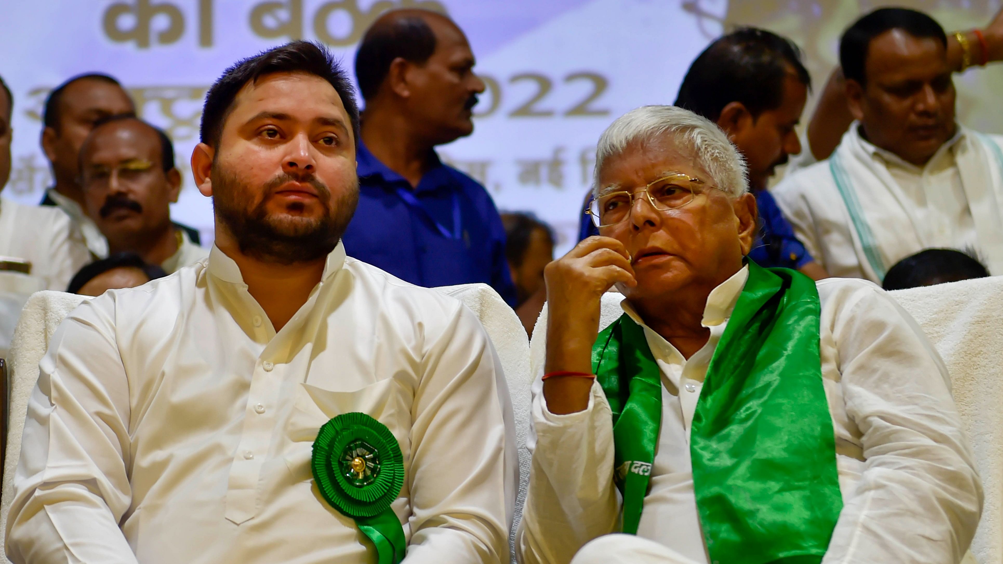 <div class="paragraphs"><p>A file photo of RJD chief Lalu Prasad with party leader and son Tejashwi Yadav.</p></div>