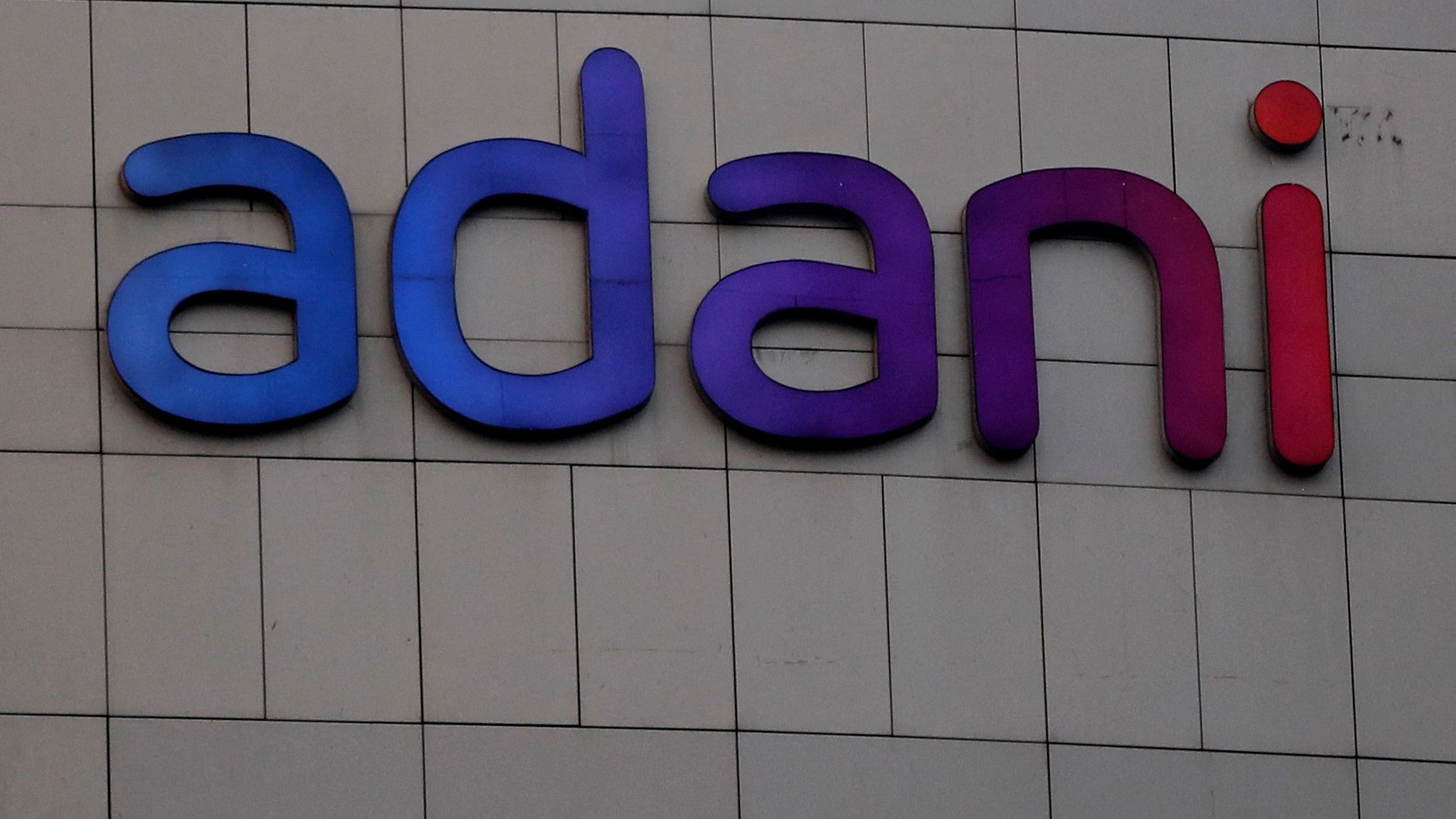 <div class="paragraphs"><p>The logo of the Adani Group is seen on the facade of its Corporate House on the outskirts of Ahmedabad</p></div>