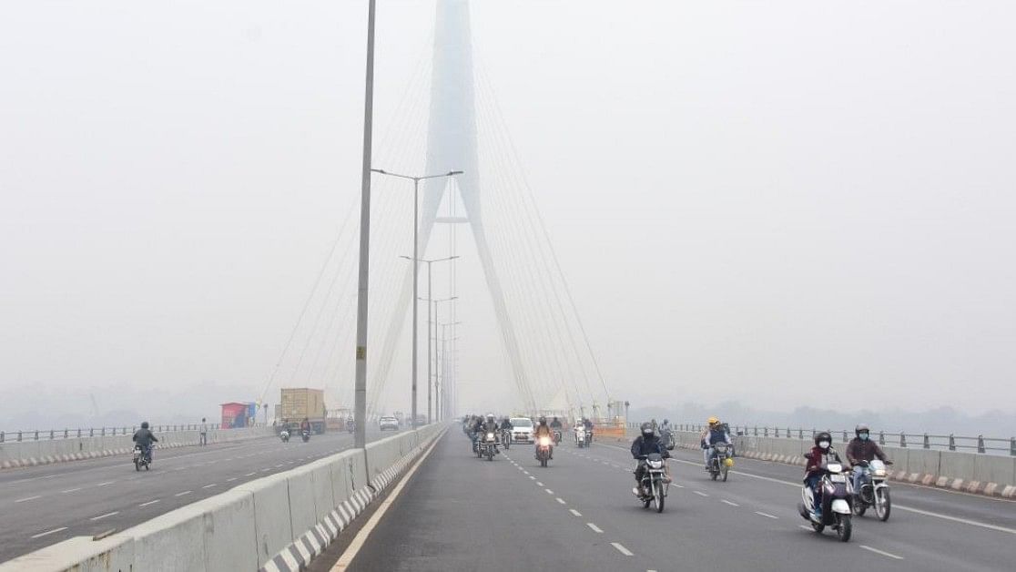 <div class="paragraphs"><p>A photo of vehicles moving on Signature bridge during a cold and foggy morning, in New Delhi. </p></div>