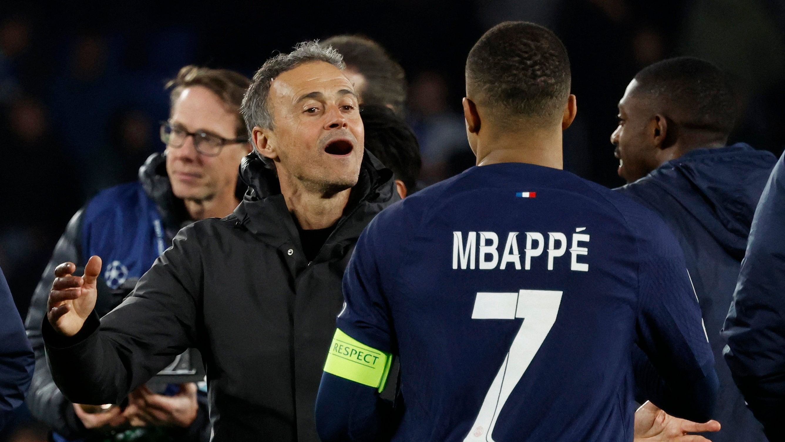 <div class="paragraphs"><p> Paris St Germain's Kylian Mbappe celebrates with coach Luis Enrique after the match.</p></div>