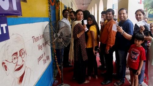 <div class="paragraphs"><p>People wait in queue to cast their votes at Lok Sabha election in New Delhi. Image for representation.</p></div>