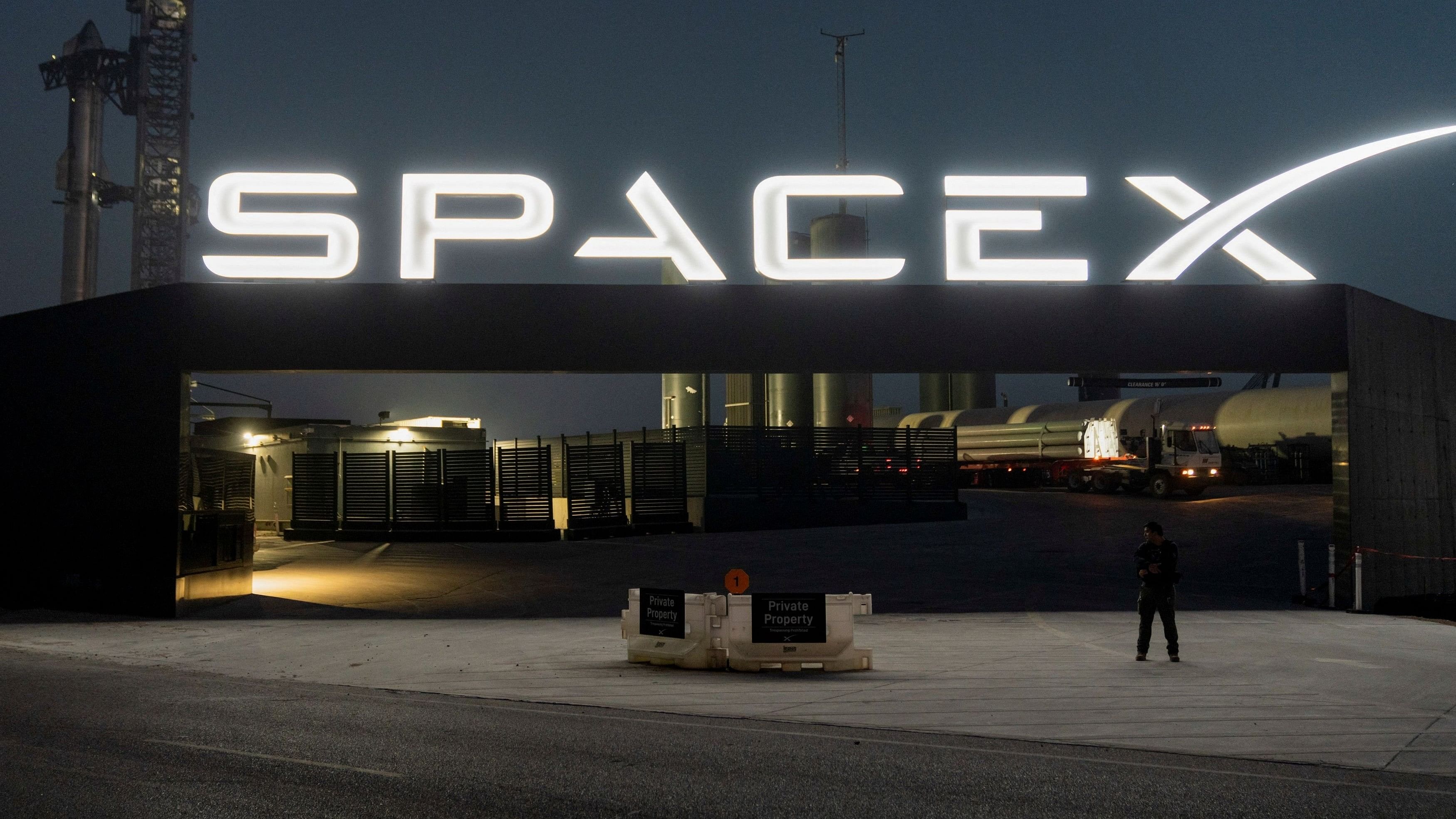 <div class="paragraphs"><p>A security guard monitors the entrance as SpaceX's next-generation Starship spacecraft atop its powerful Super Heavy rocket is prepared for a third launch from the company's Boca Chica launchpad on an uncrewed test flight, near Brownsville, Texas, U.S. March 13, 2024. </p></div>