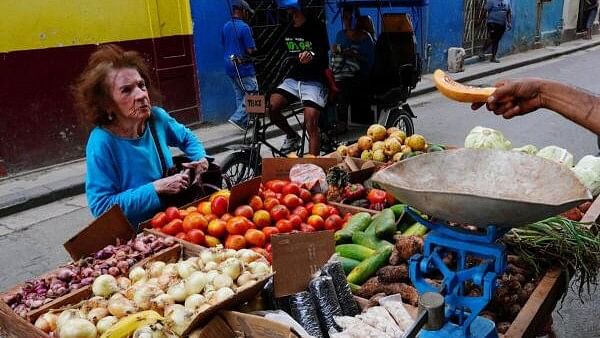 <div class="paragraphs"><p>A woman buys a piece of pumpkin in Havana, Cuba.</p></div>