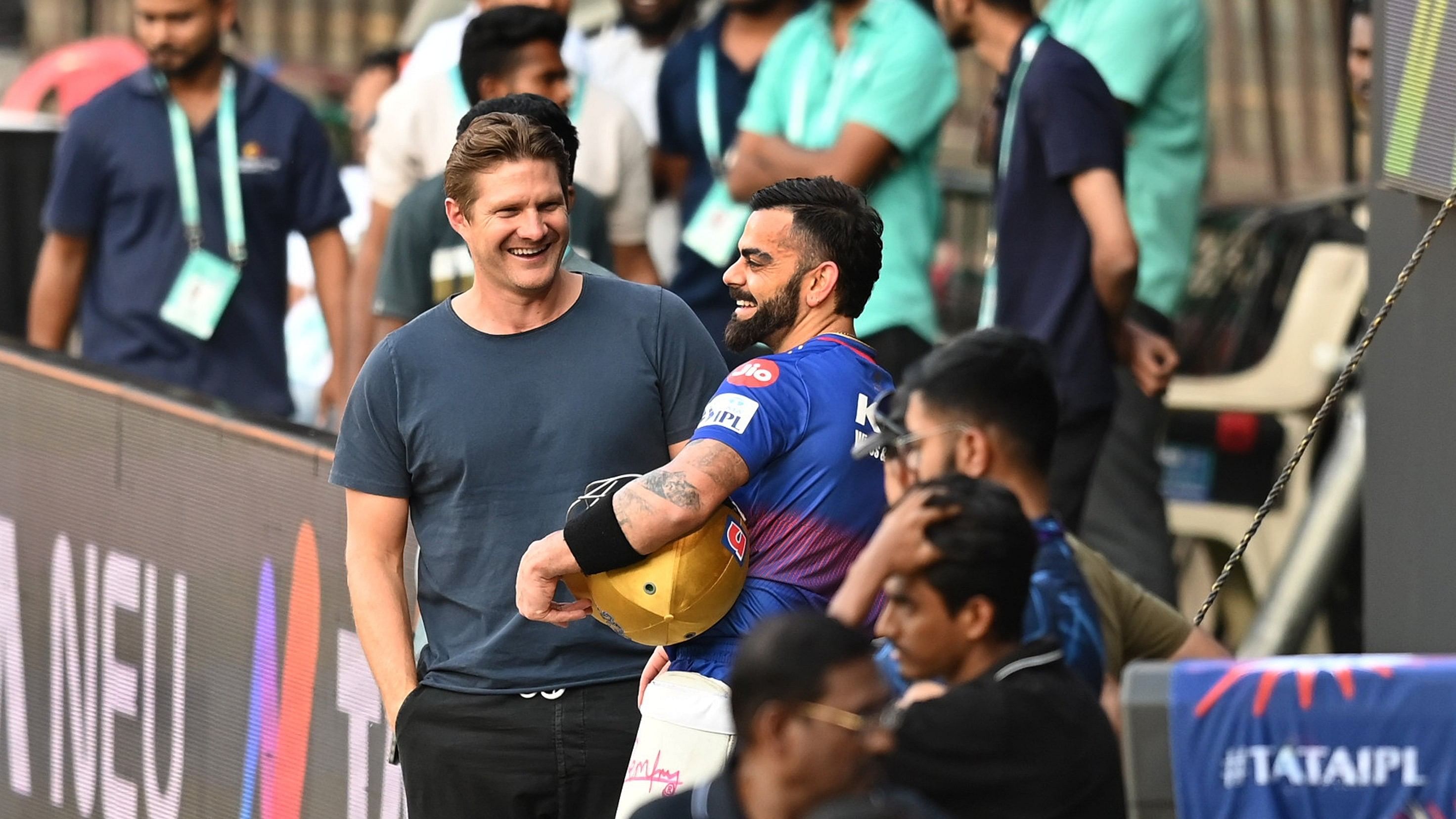 <div class="paragraphs"><p>Royal Challengers Bengaluru’s Virat Kohli (right) catches up with former RCB player Shane Watson during Thursday’s training session. </p></div>
