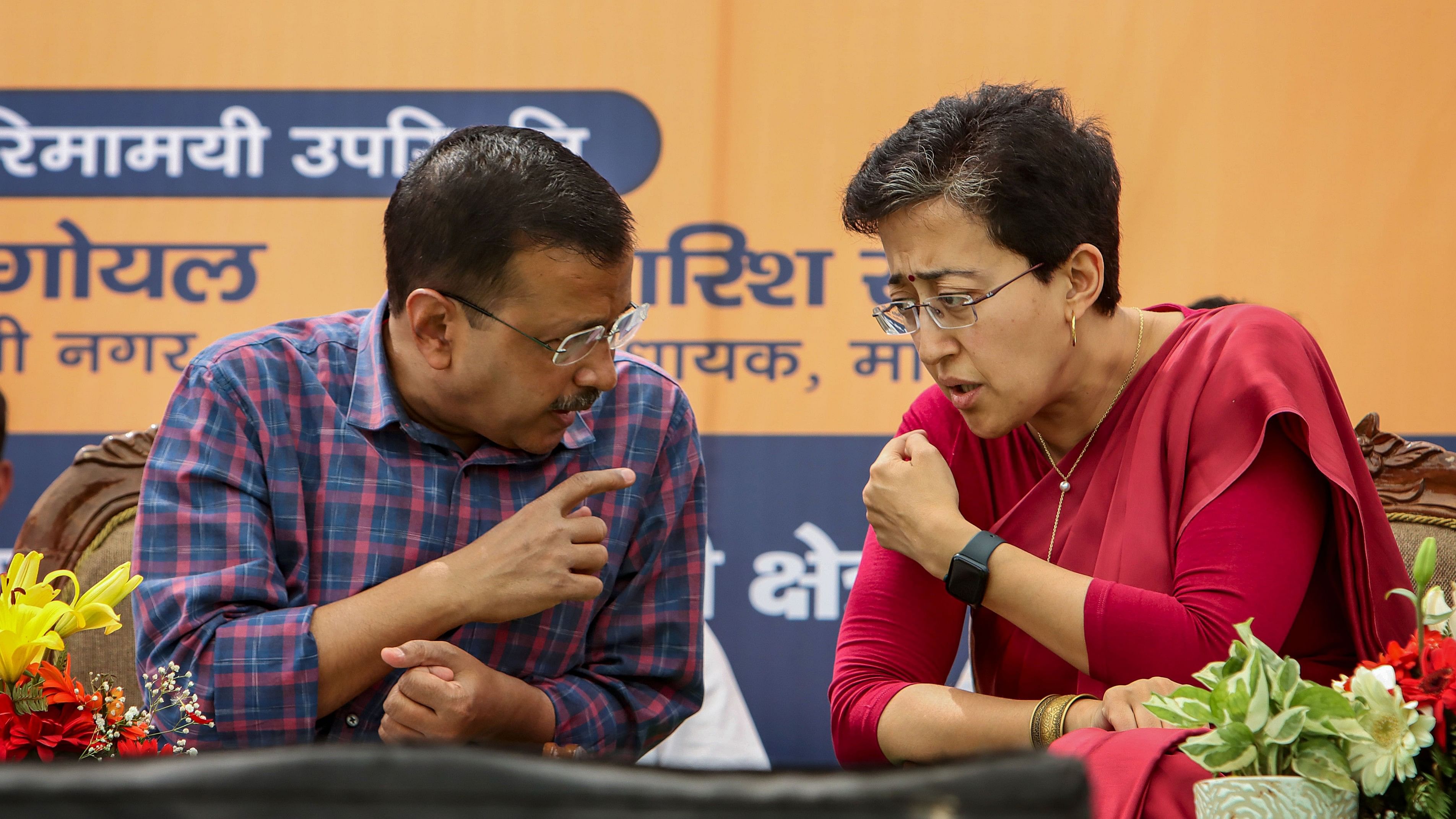 <div class="paragraphs"><p>Former Delhi CM Arvind Kejriwal and CM designate Atishi.</p></div>