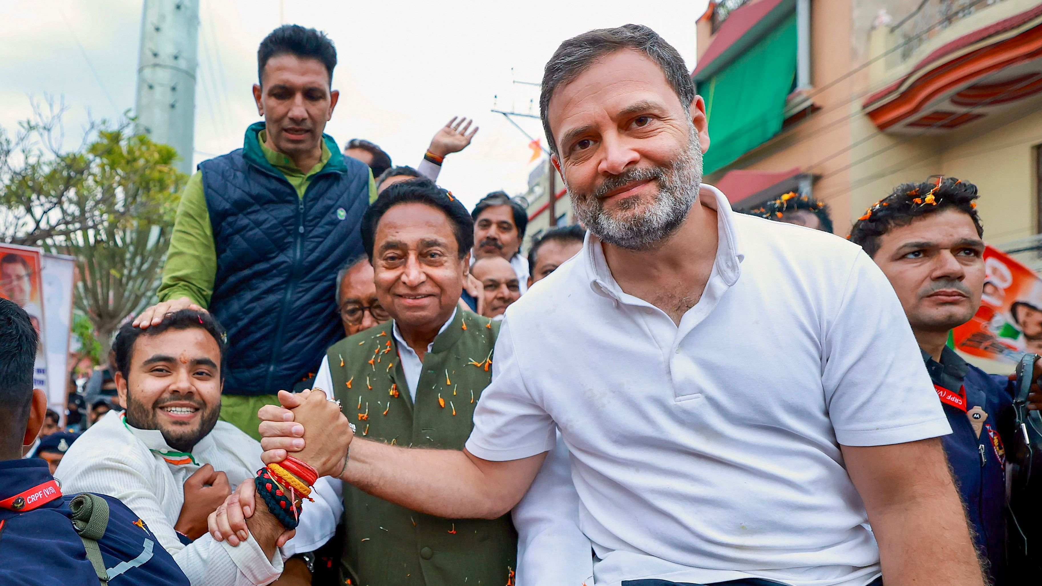 <div class="paragraphs"><p>Congress leader Rahul Gandhi with Madhya Pradesh state party President Jitendra Patwari, party leader Kamal Nath and others greets a supporter at a roadshow during the Bharat Jodo Nyay Yatra in Madhya Pradesh.</p></div>