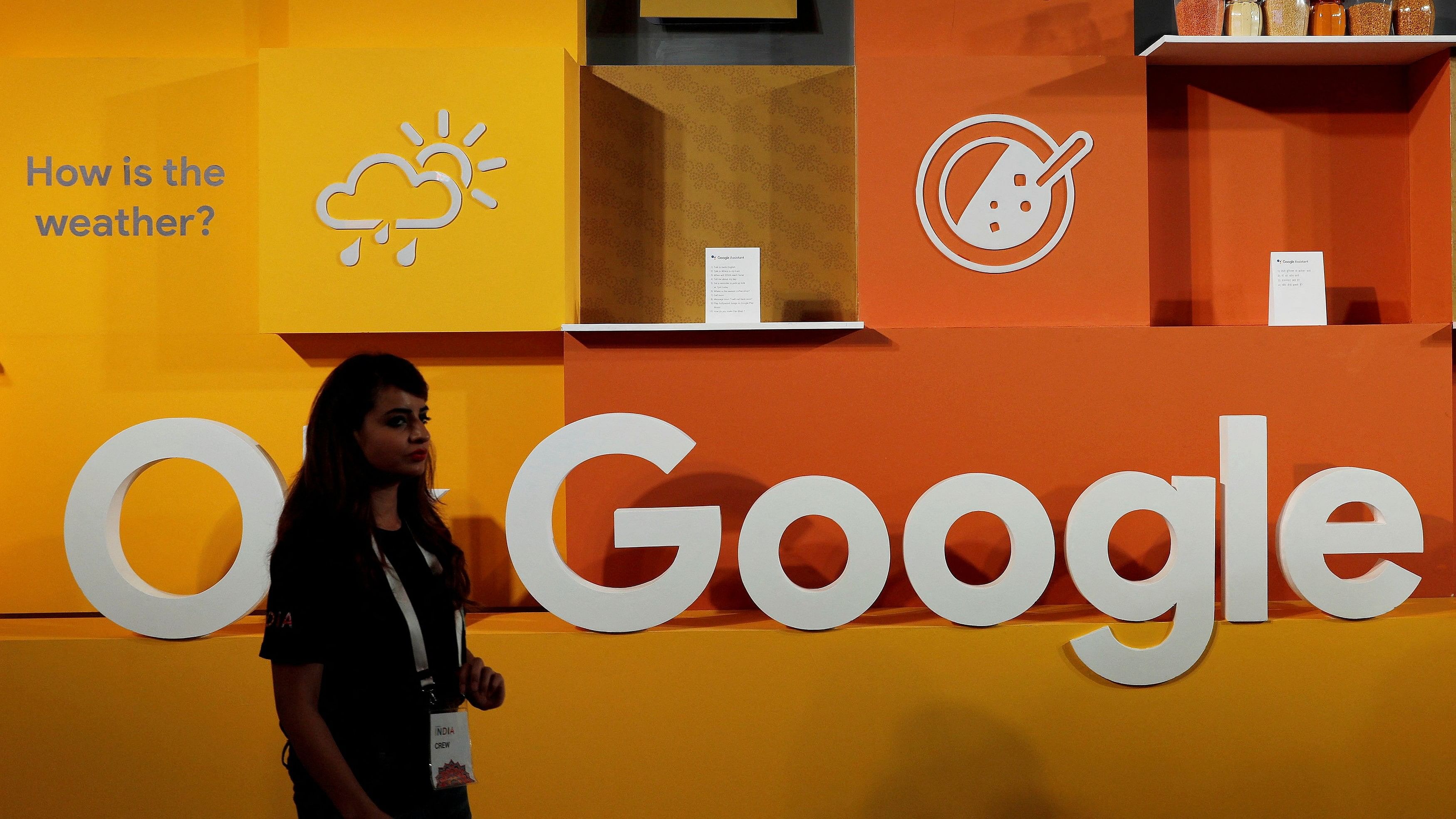 <div class="paragraphs"><p>A file image of a woman walking&nbsp; past the logo of Google during an event in New Delhi.</p></div>