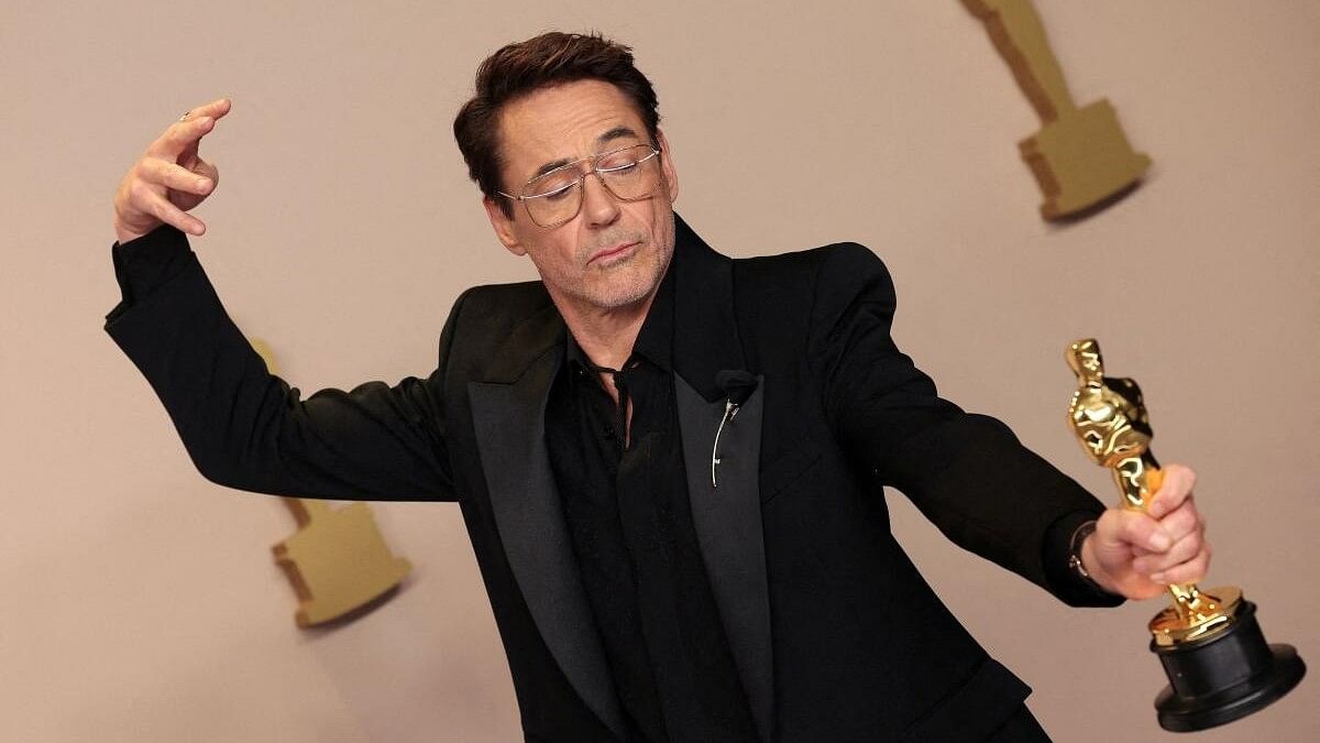 <div class="paragraphs"><p>Robert Downey Jr. poses with the Best Supporting Actor Oscar for "Oppenheimer", in the Oscars photo room at the 96th Academy Awards in Hollywood, Los Angeles, California, US, March 10, 2024. </p></div>