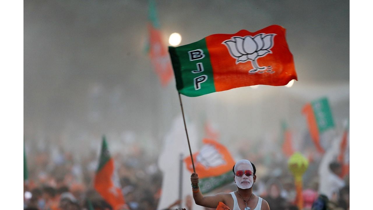 <div class="paragraphs"><p>Representative image of BJP supporters waving a party flag. Representative image. </p></div>